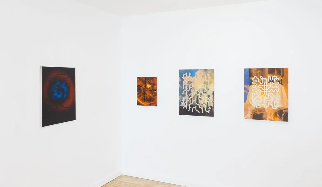 Gallery wall with four abstract paintings on a white wall in an art gallery.