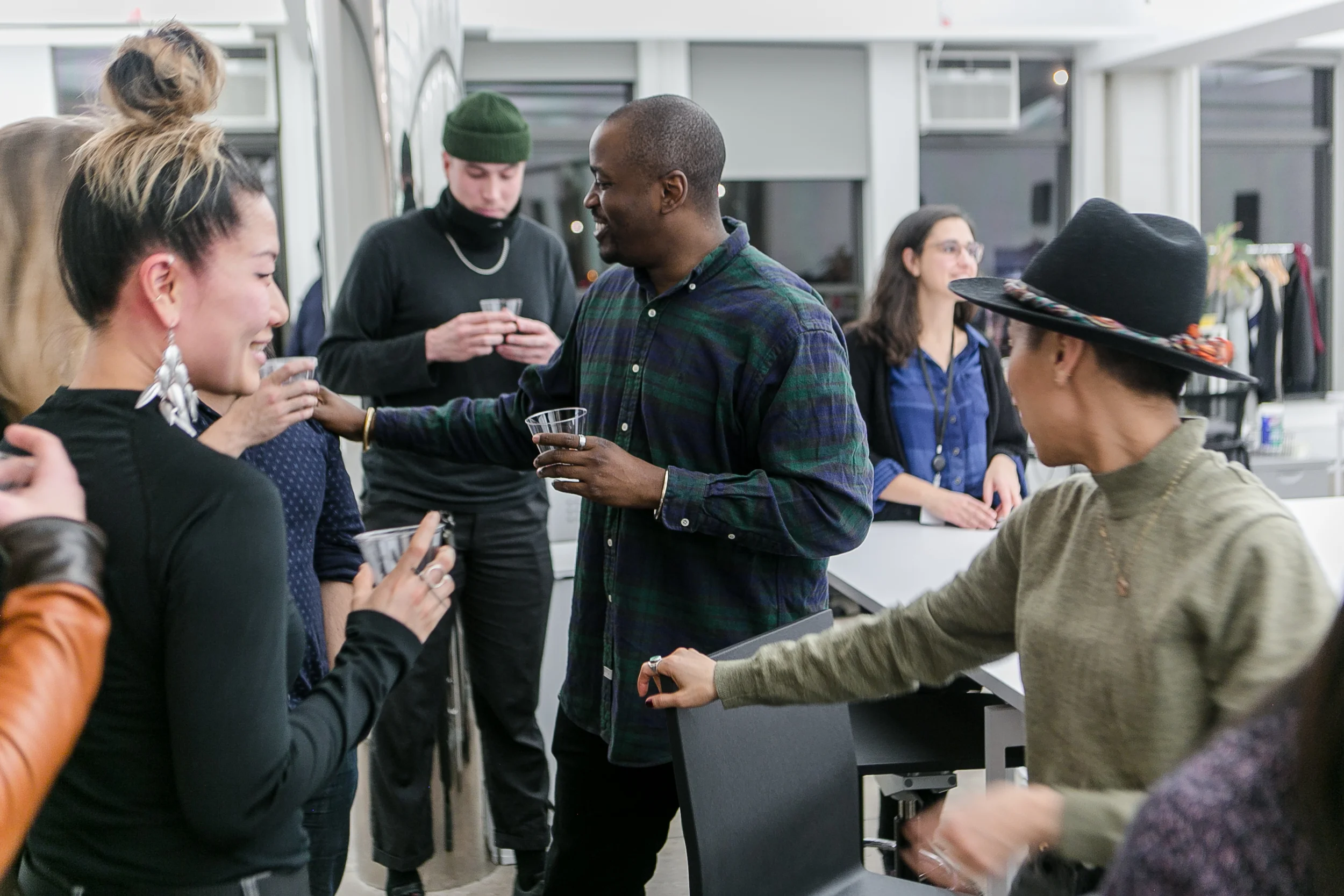 a NEW INC community gathering. Links to Members page.