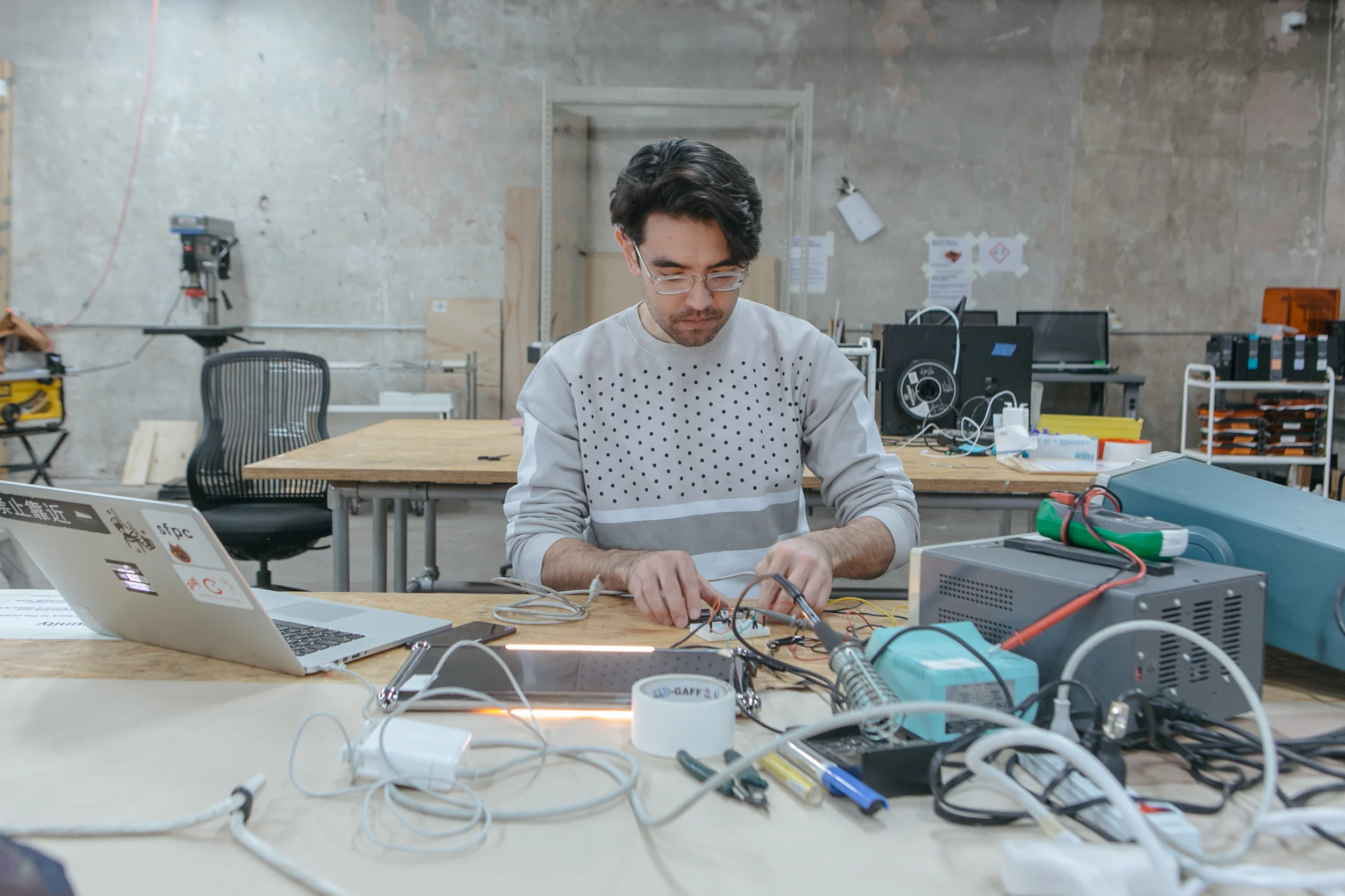 NEW INC member in fabrication lab