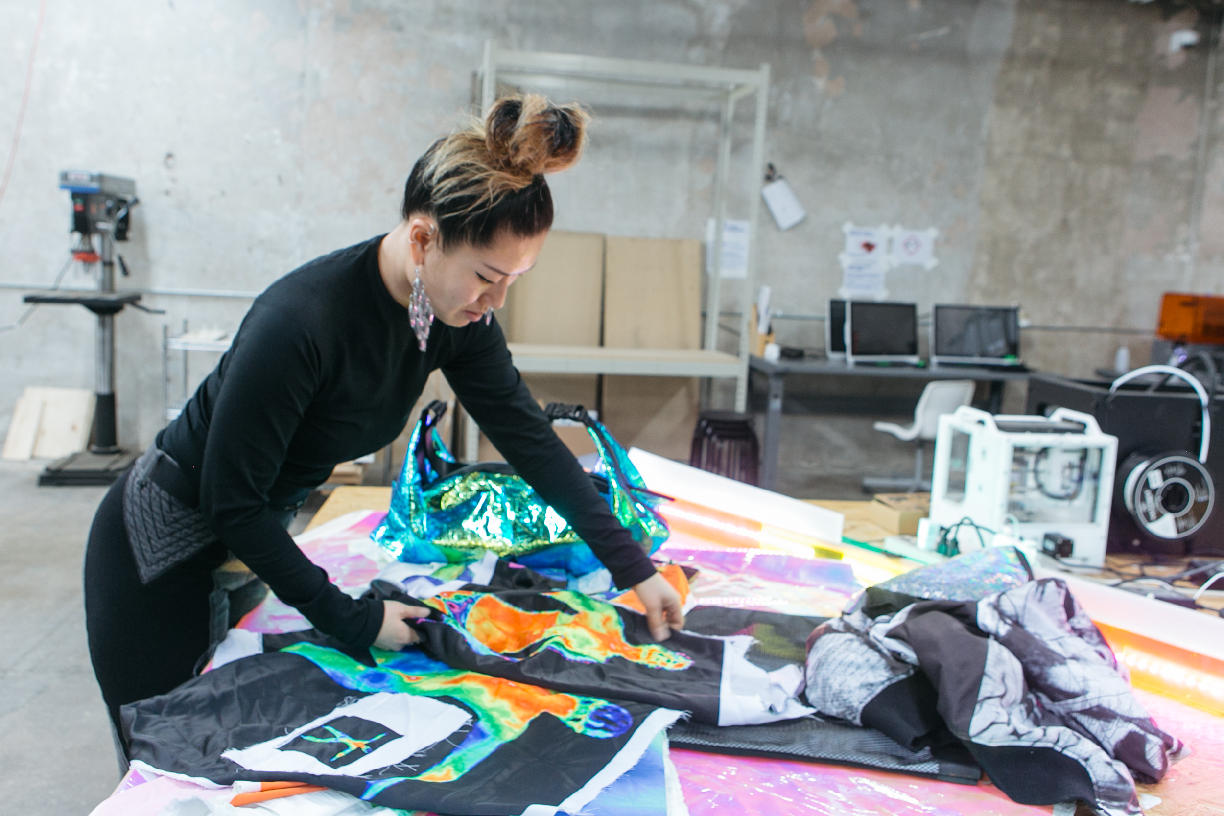 NEW INC member working with textiles