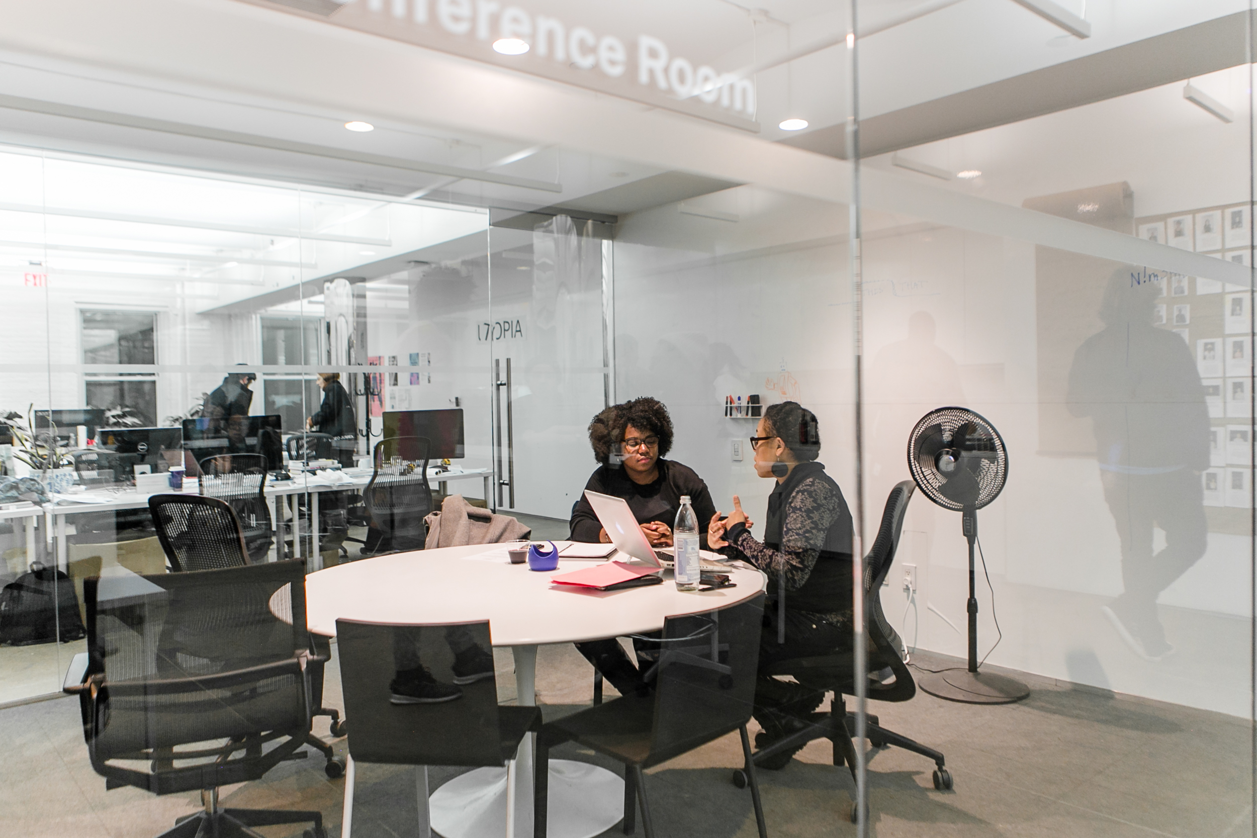 NEW INC members in conference space