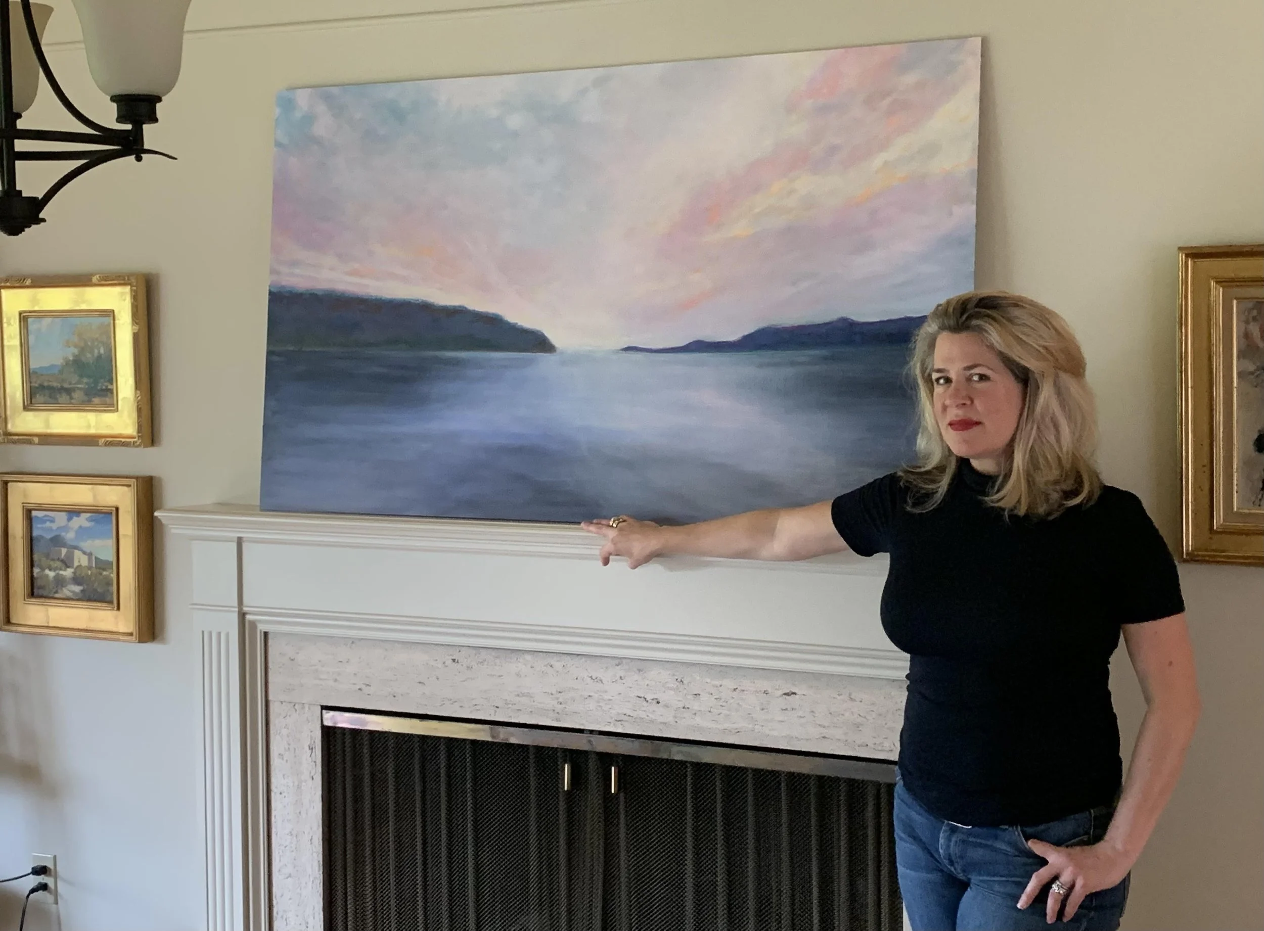 Lisa Butters with her original painting Salish Sky