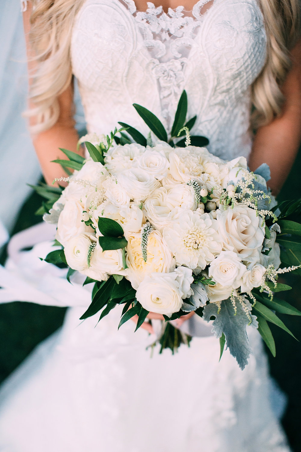 closeup_bridal_bouquet_white_roses_ranunculus, veronica_dusty_miller_sacramento_roseville.jpg