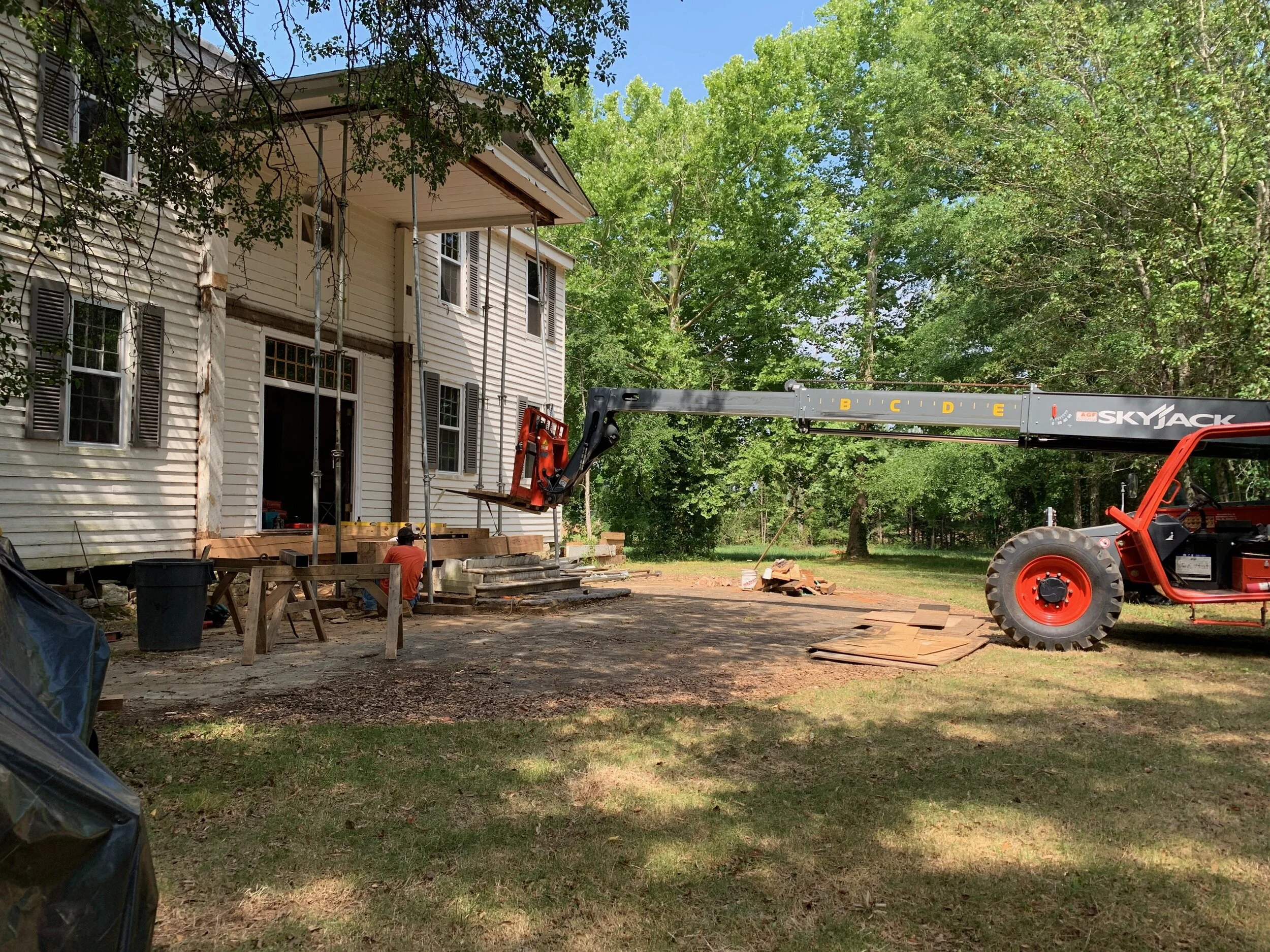 front porch with skyjack.JPG