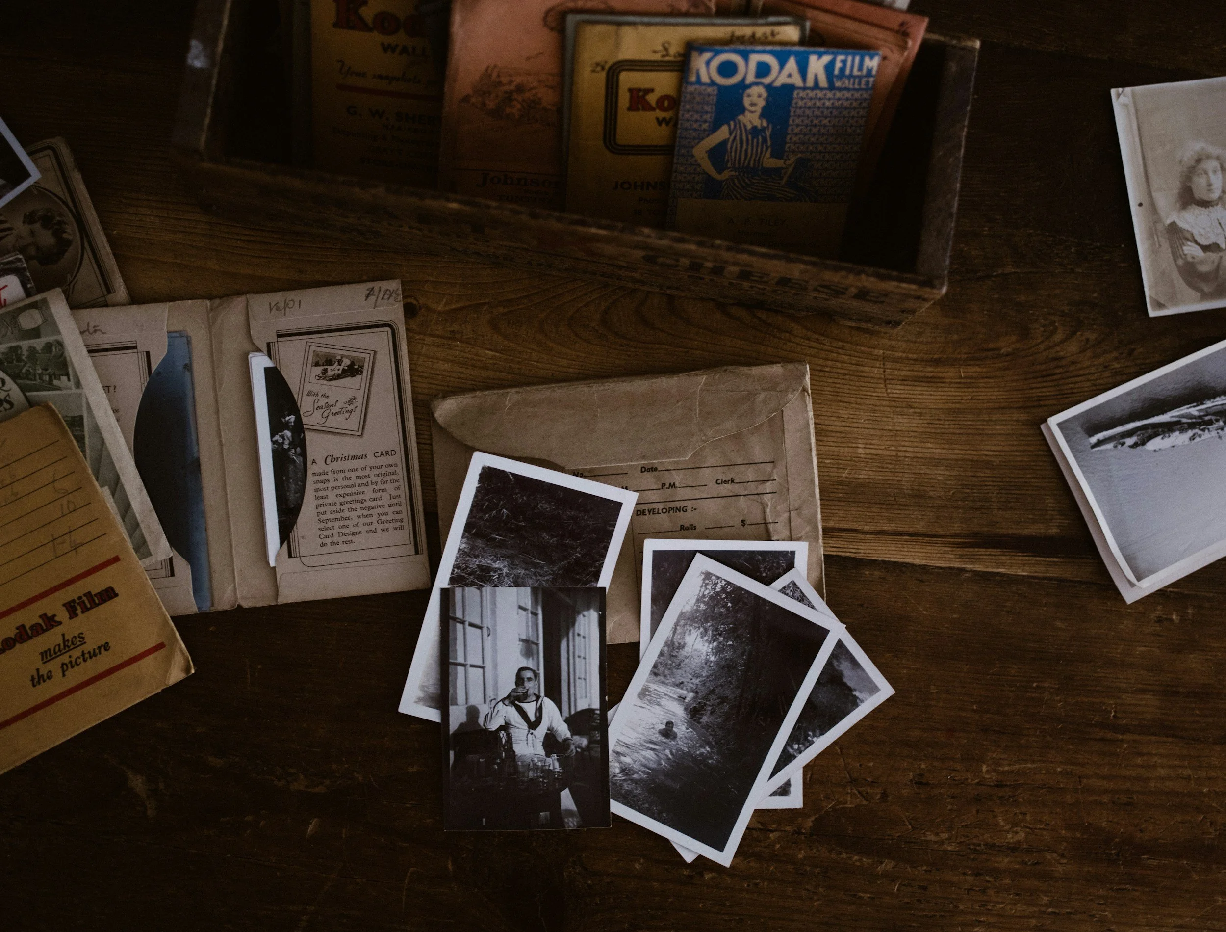 Vintage Blcak and White Photographs on a Table - help restoring old photos for memorial cards ireland