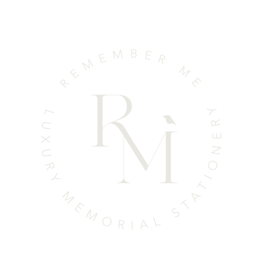 Circular logo with the text "Remember Me Your Memory Station" surrounding stylized initials "R M" with a small bird perched on the top of the "M".