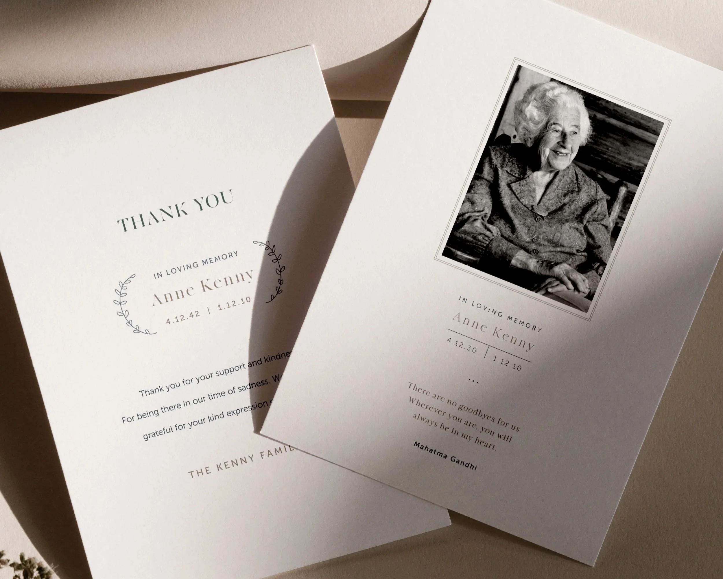 Memorial thank you notes for Anne Kenny, one with a black and white portrait photograph of her smiling, and the other with floral decoration and written message of gratitude.