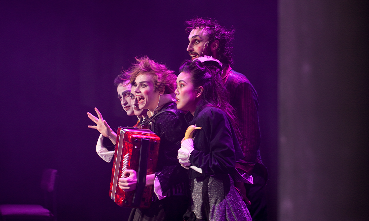 Performers on stage at The Warren