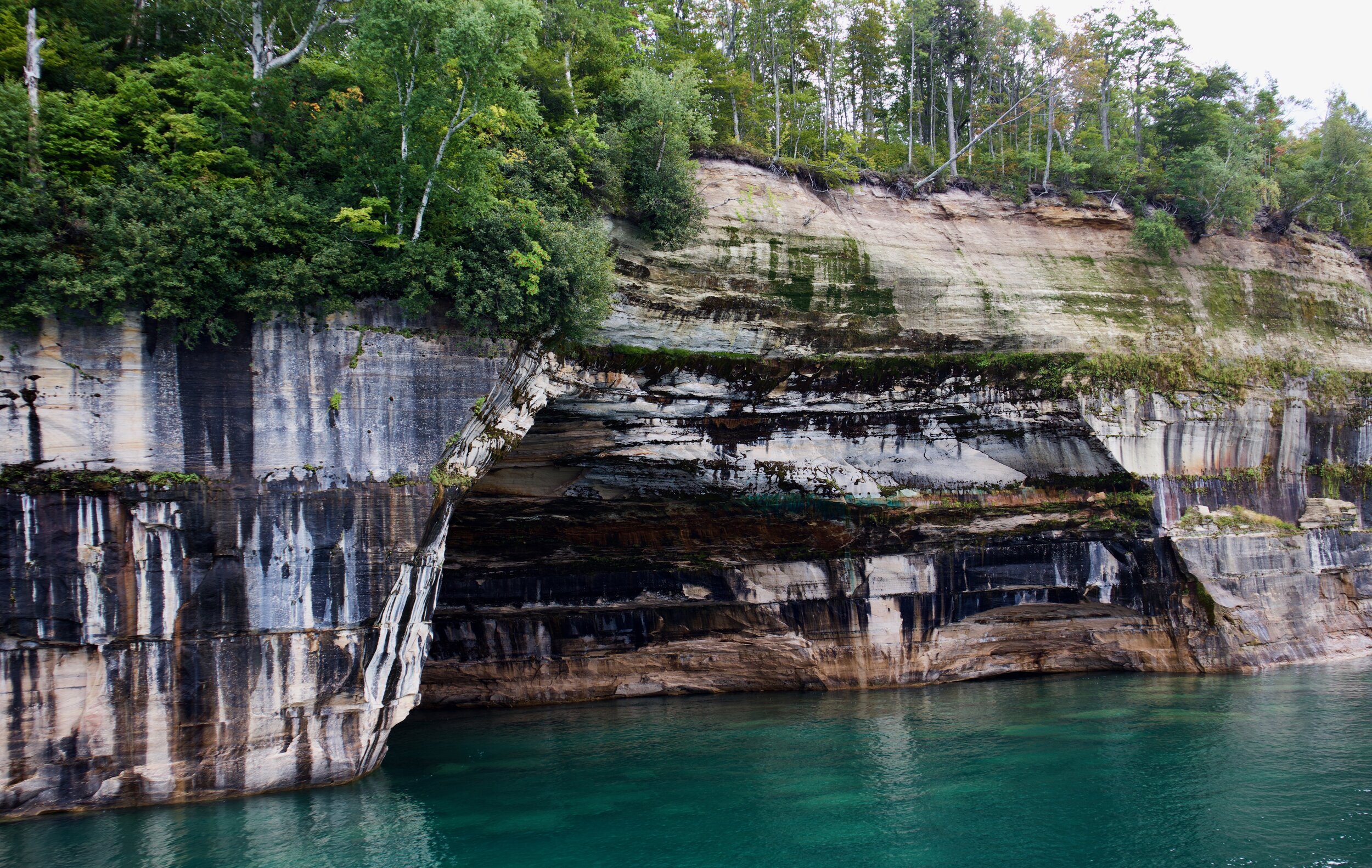 This is a pretty good example of what different minerals and water can create. All along the cliffs it appears there are trees hanging on to the rocks for dear life!