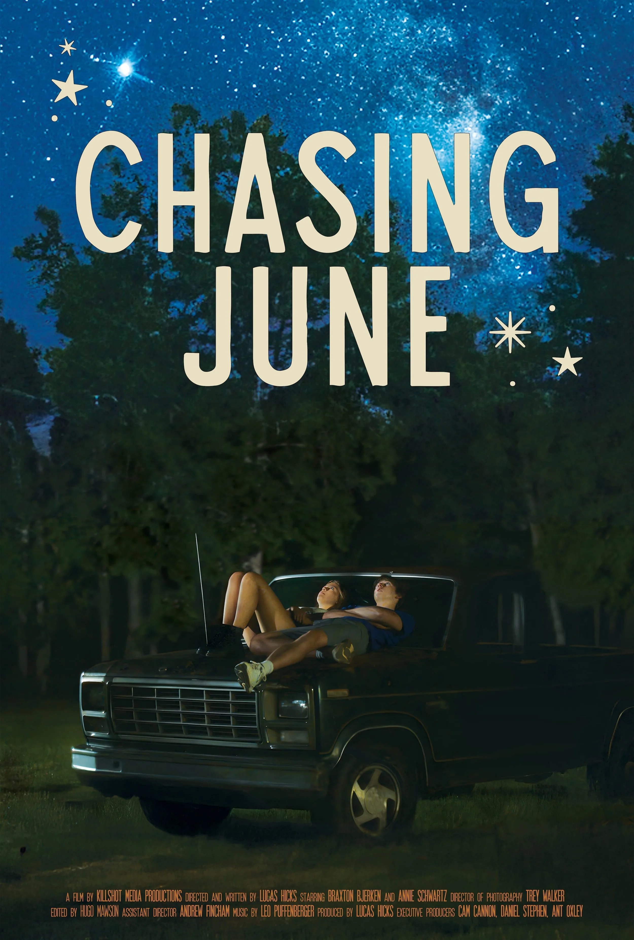 Two teenagers lying on the hood of a black pickup truck at night, looking at the starry sky. The scene is outdoors among trees under a clear night sky. The title 'Chasing June' is shown at the top with decorative stars.