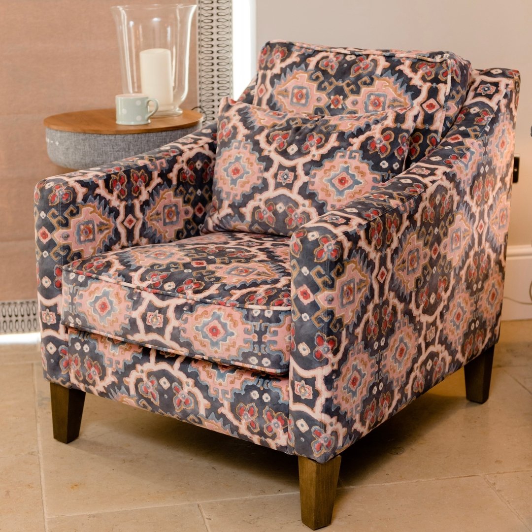 How comfortable does this chair look? It&rsquo;s the perfect spot for reading the paper, drinking your morning coffee or cheeky evening G&amp;T! We&rsquo;re also loving the trendy speaker table. 

This gorgeous Linwood fabric has been used all over, 