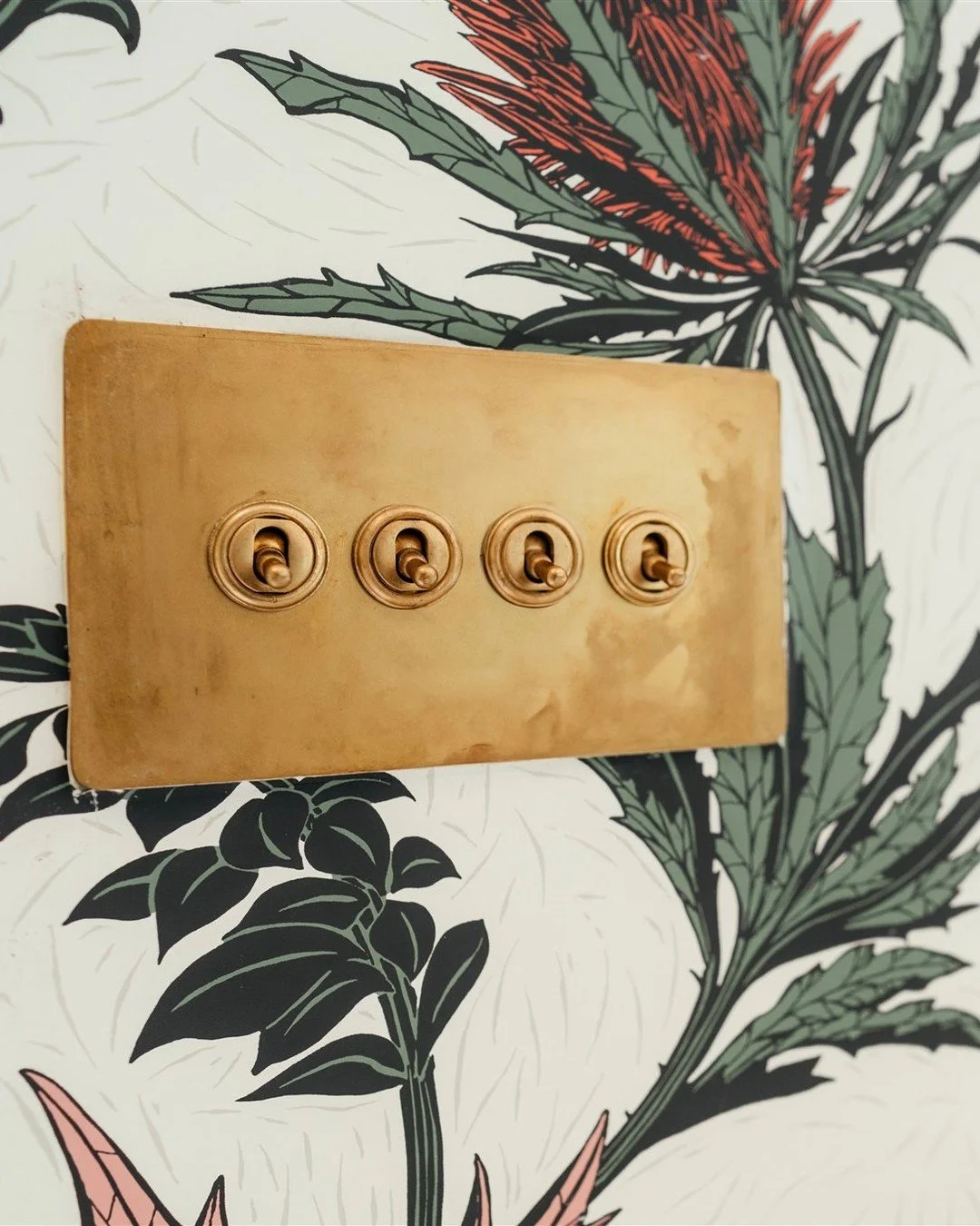 This is a thing of beauty!  I mean, it's not everyones cup of tea but for those who do look at interiors and details in particular then this aged brass 4 gang toggle switch is gorgeous, coupled with the slimline back plate with hidden fixings.

Even 