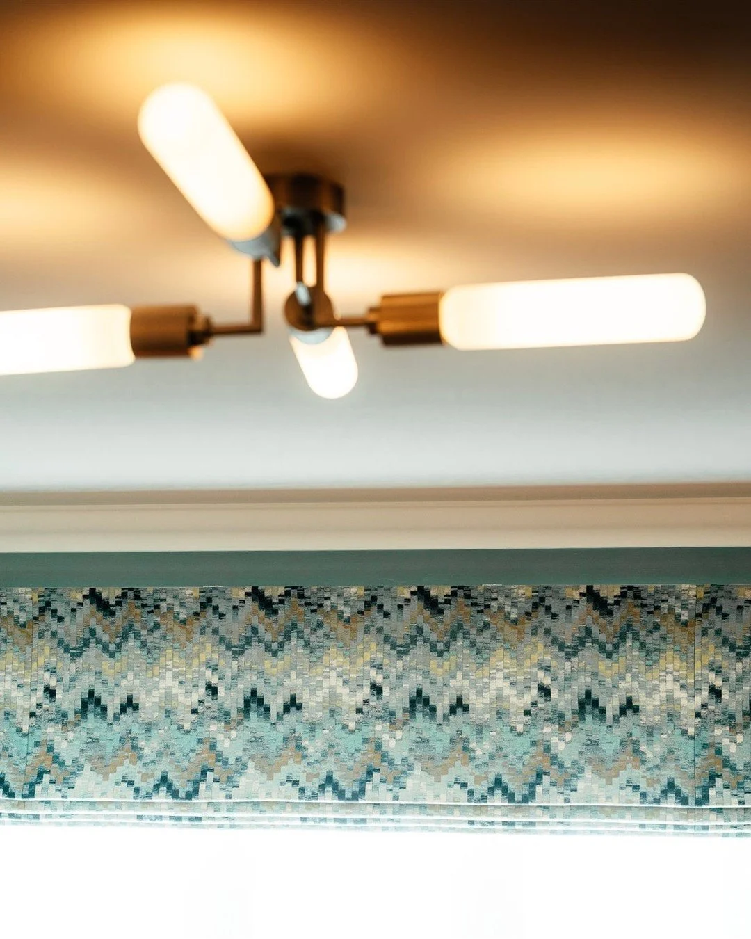 We love this Dowsing &amp; Reynolds light, perfectly suited to this home office. The room scheme was inspired by aviation, with a subtle nod to airplane propellers reflected in this striking piece.

Lighting is key &mdash; especially in a task-focuse