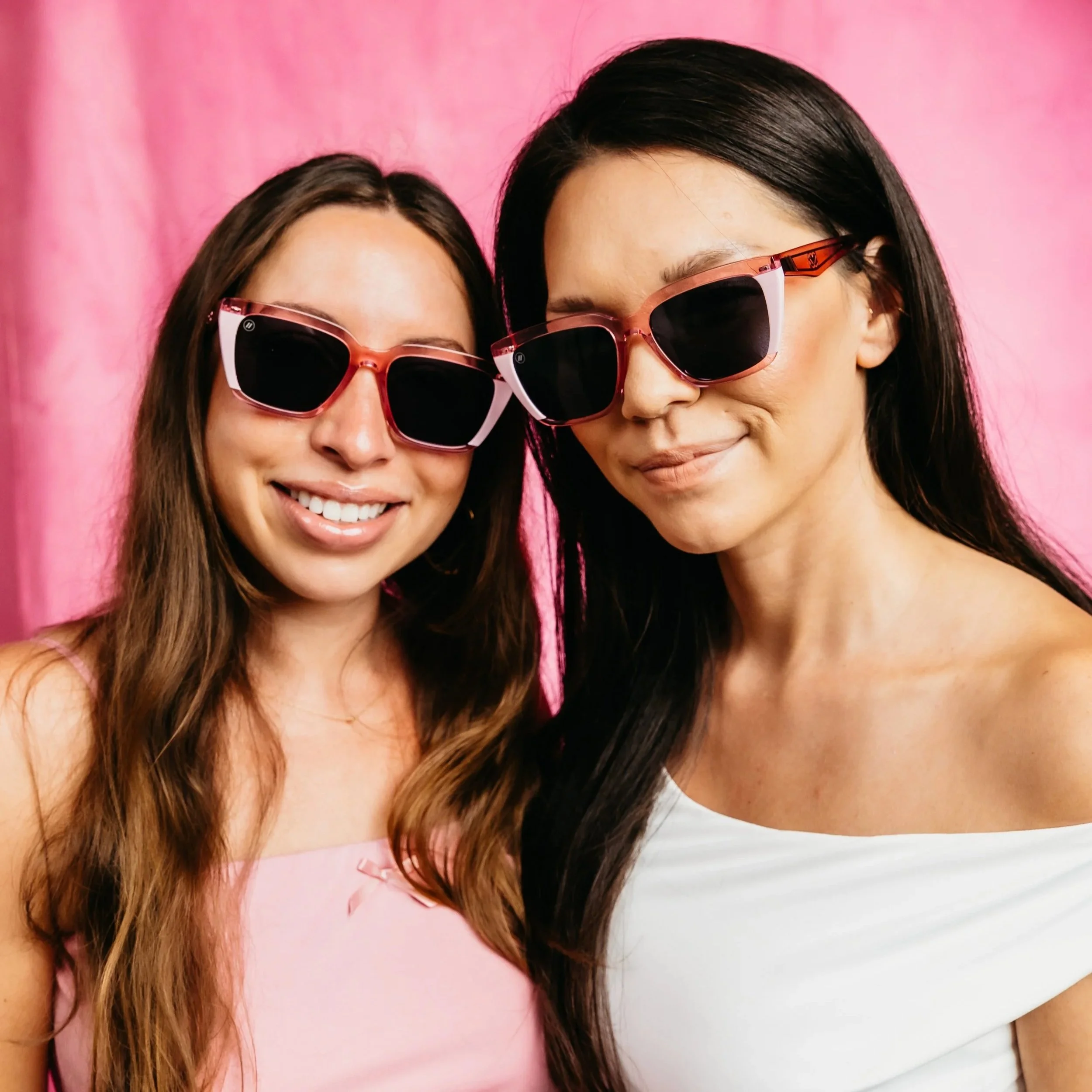 Two women with Blenders brand sunglasses.