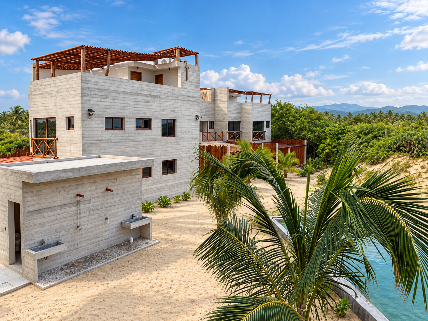 Residencias contemporáneas de concreto aparente con terrazas, palmeras y alberca en Puerto Bambú, Puerto Escondido, Oaxaca.
