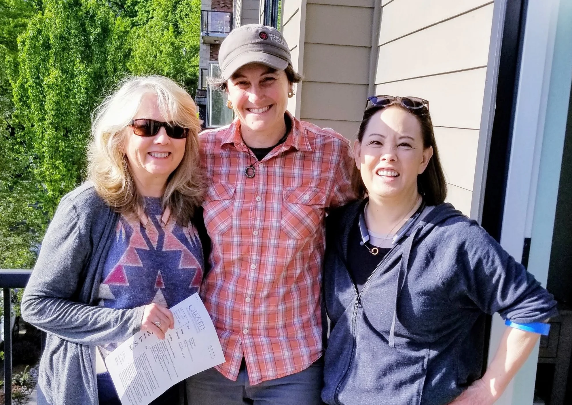 Diana Zapata, my Design Partner-in-Crime, Kendal, forewoman with Lovett Deconstruction and me outside of the homes of one of our projects.