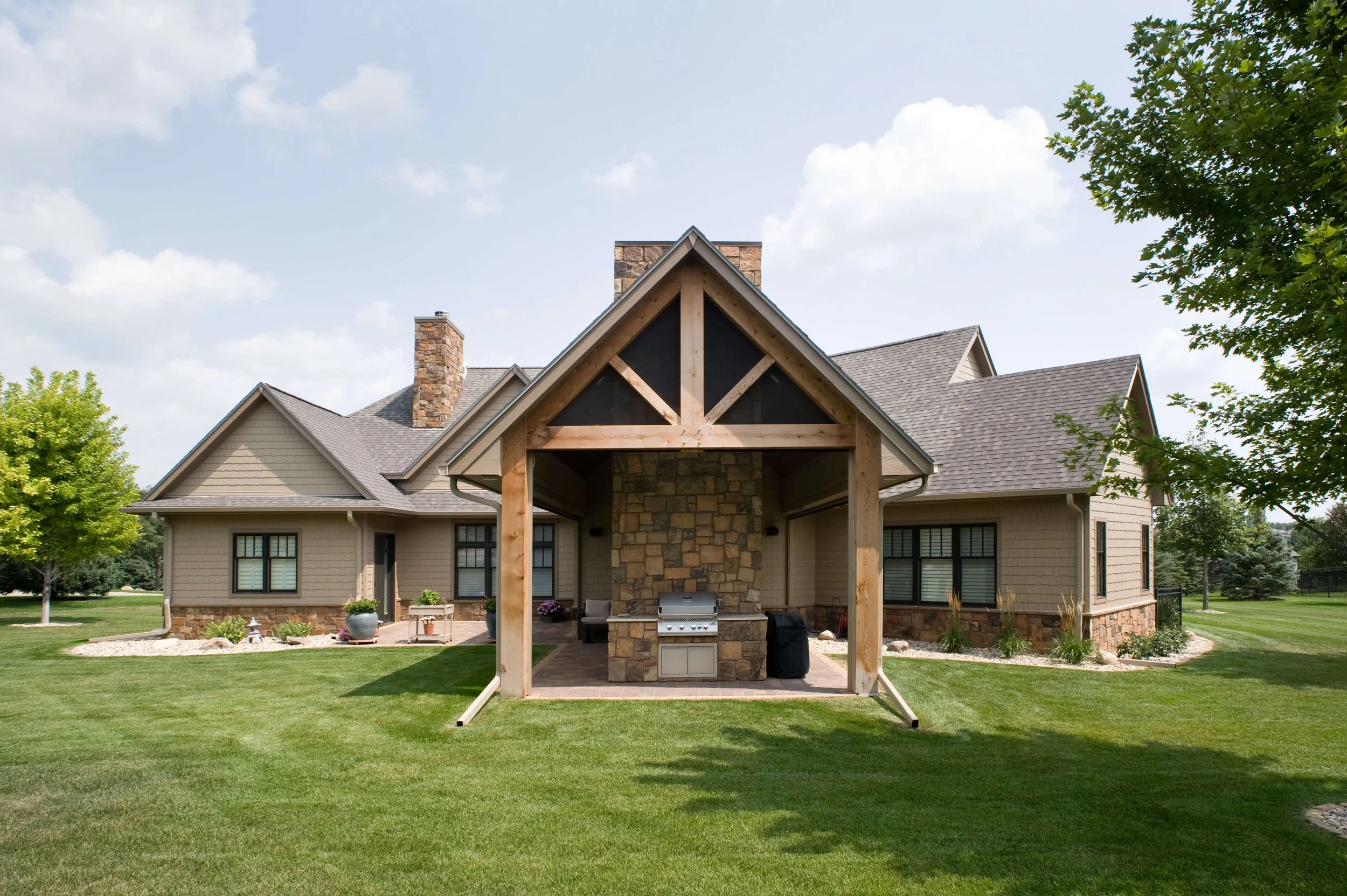addition, covered patio, outdoor fireplace, outdoor kitchen, screened in patio, grill, fireplace, timber frame, timbers, gable, phantom screens, stone fireplace, paver patio, landscaping