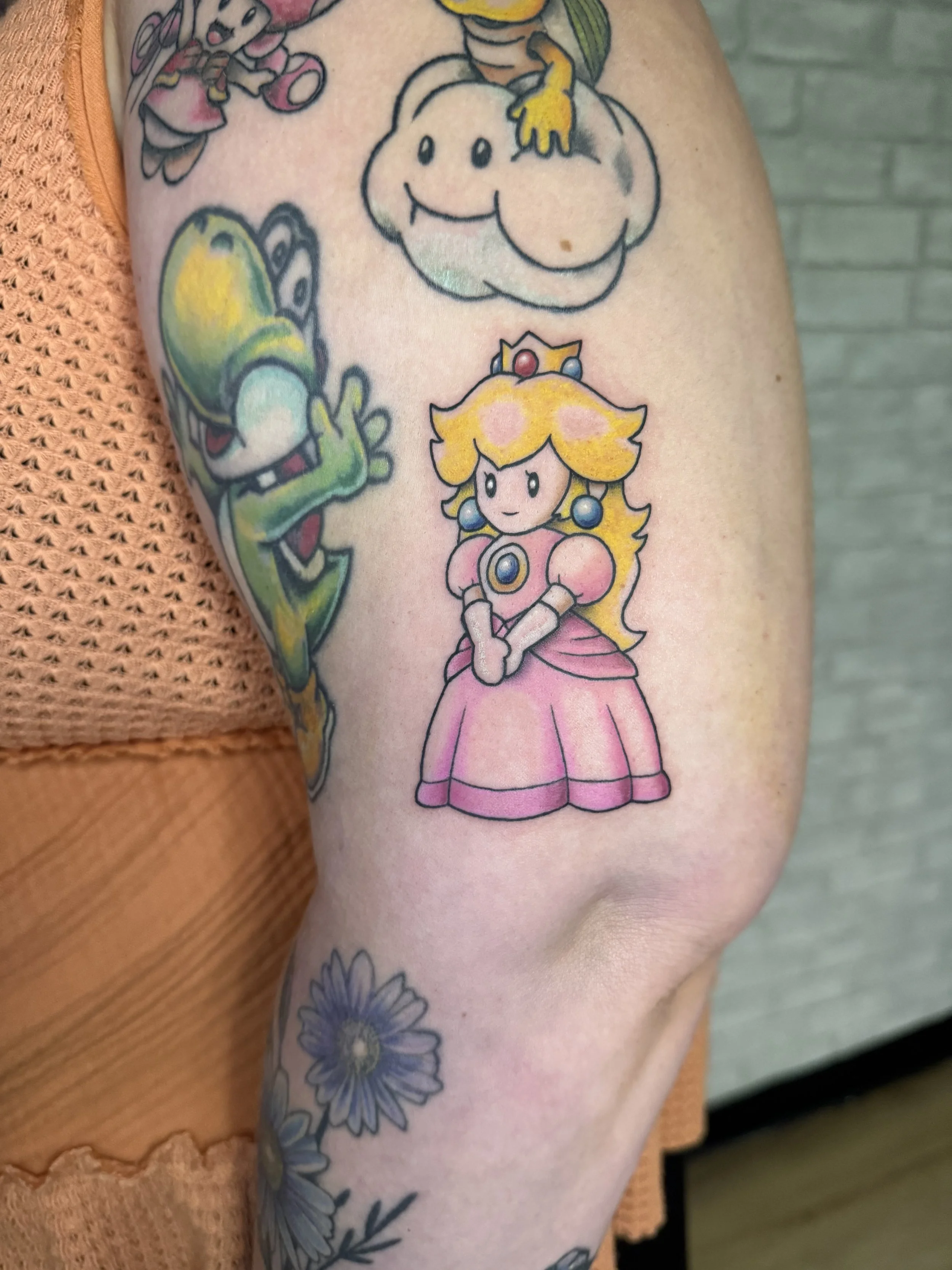 evol tattoo, local tattoos, lehigh valley tattoos, allentown tattoos, color tattoo, video game tattoo, nintendo tattoo, princess peach tattoo, cartoon tattoo, mario tattoo, cute tattoo, pretty tattoo.jpeg
