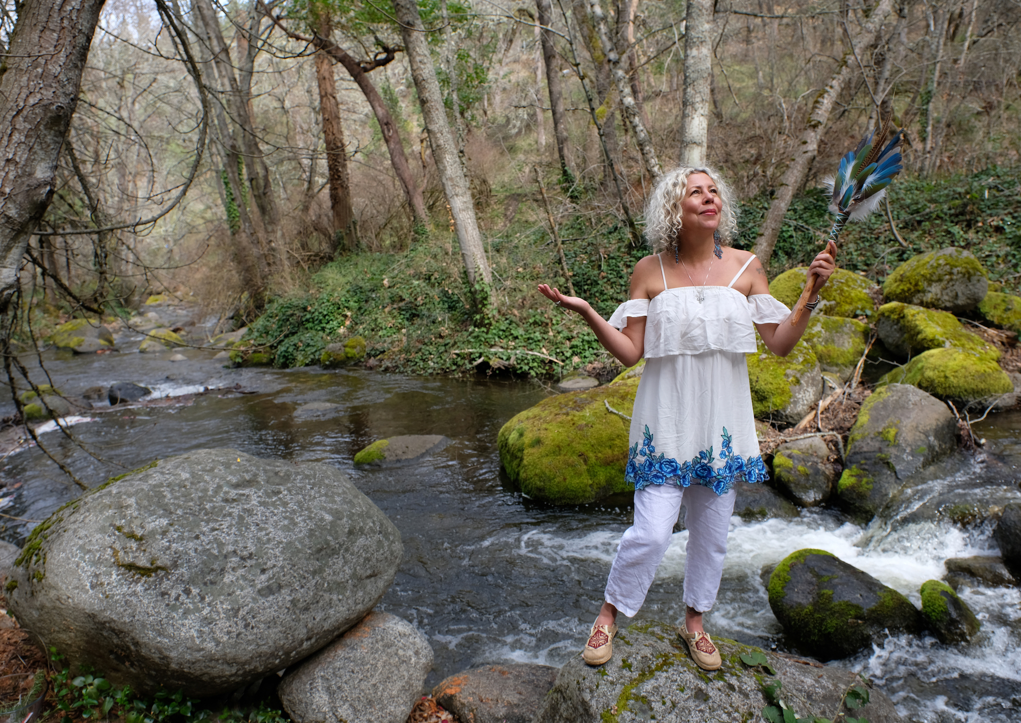 clairvoyant healer from Belize with smudge feather fan.jpg