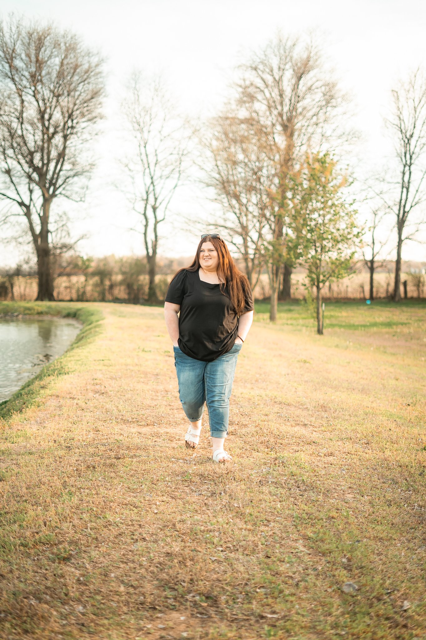  VEast Prairie Senior Portrait Session. Senior Photographer near Cape Girardeau Missouri. Golden Hour session with pond. Hobbies including four wheelers, fishing and drawing. Senior Session in Nature. Plus Sized Senior Portrait ideas. Poses for plus 