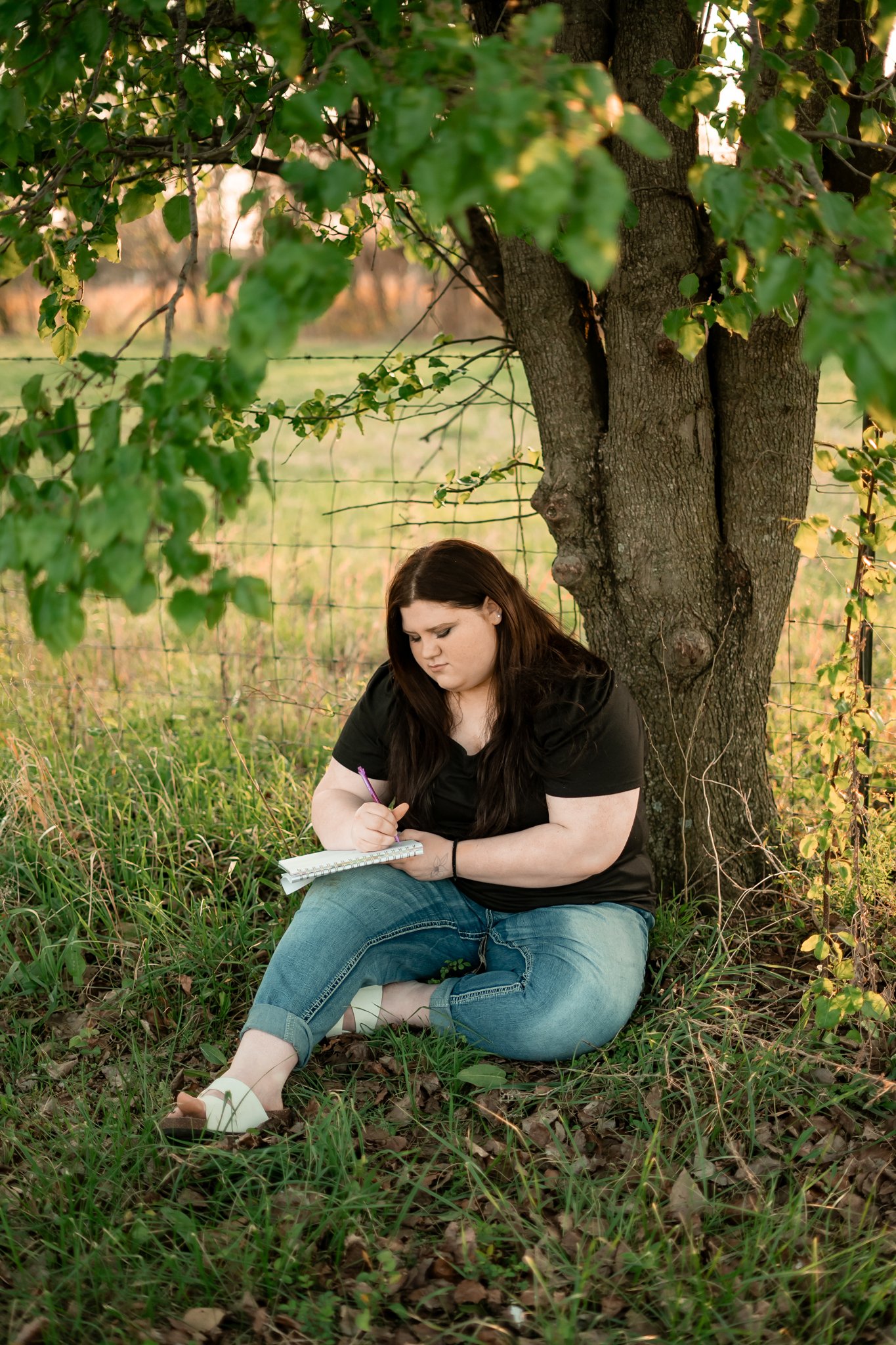  East Prairie Senior Portrait Session. Senior Photographer near Cape Girardeau Missouri. Golden Hour session with pond. Hobbies including four wheelers, fishing and drawing. Senior Session in Nature. Plus Sized Senior Portrait ideas. Poses for plus s