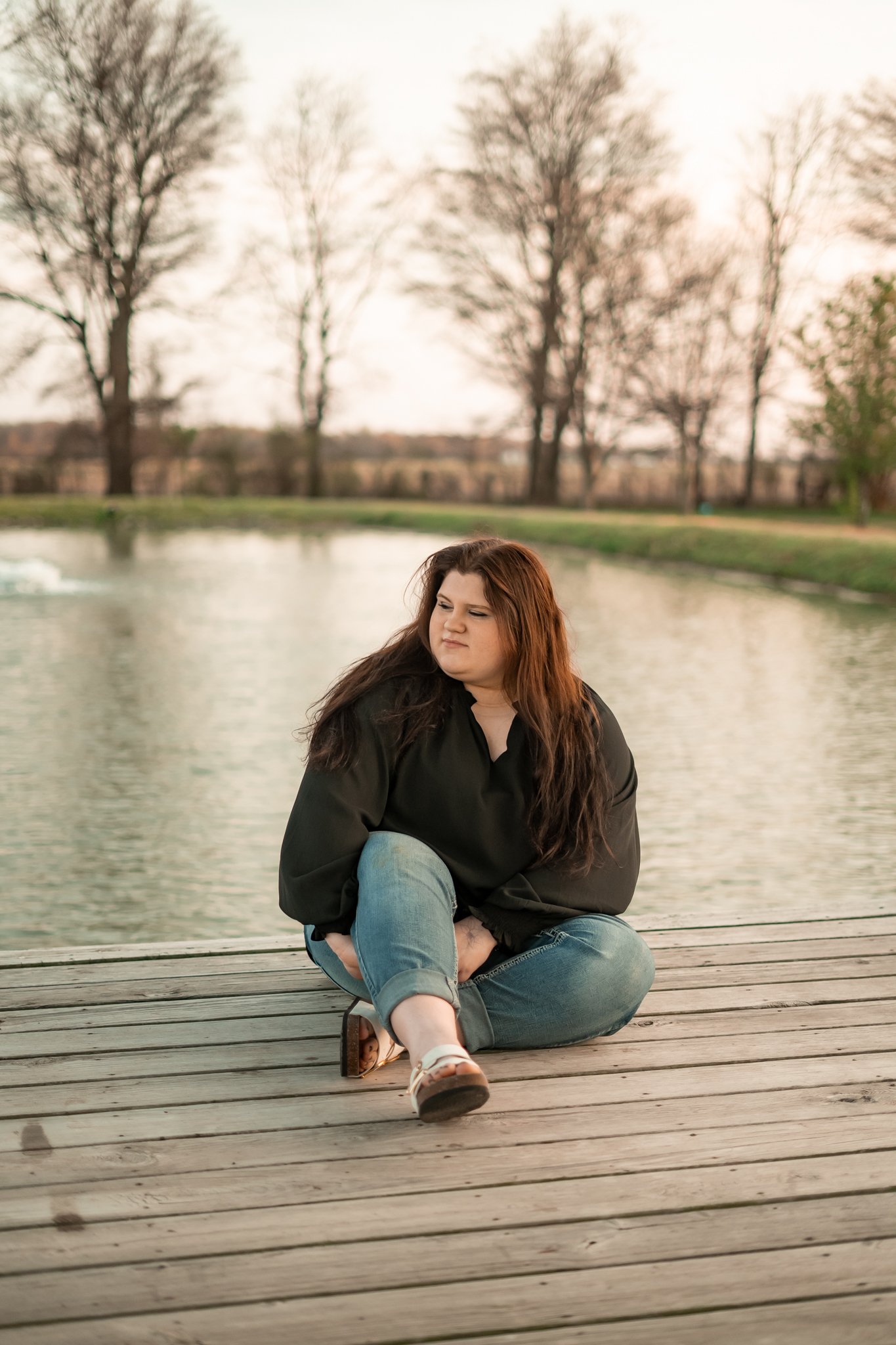  East Prairie Senior Portrait Session. Senior Photographer near Cape Girardeau Missouri. Golden Hour session with pond. Hobbies including four wheelers, fishing and drawing. Senior Session in Nature. Plus Sized Senior Portrait ideas. Poses for plus s