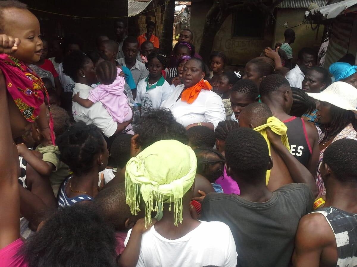  WFWP staff trying to control the crowd in Duport Road by forming a cube for distribution but as the news spread and the crowd grew large, it became difficult to... 