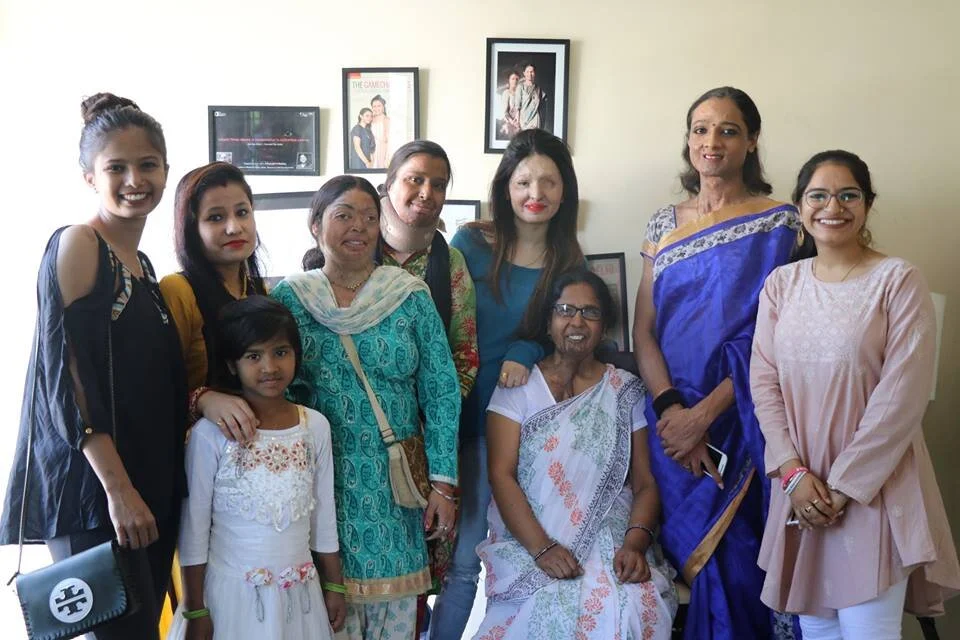 Our survivors, volunteers, and a survivors child at rehab center