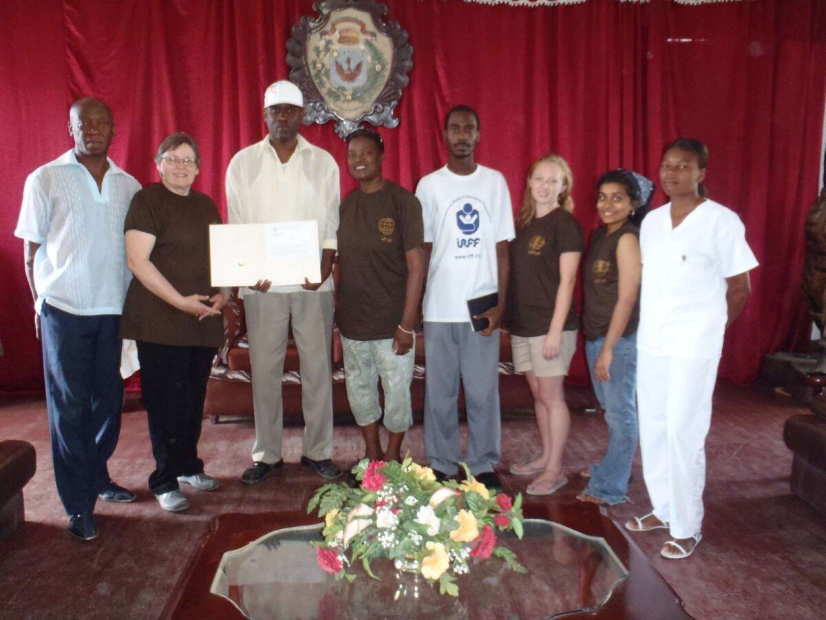 Mrs. Brewster presenting Mayor Fritz Joseph an official letter