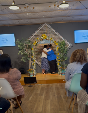 BofP Bruna & Mrs Alston hugging 2026 - Bruna Allen.png