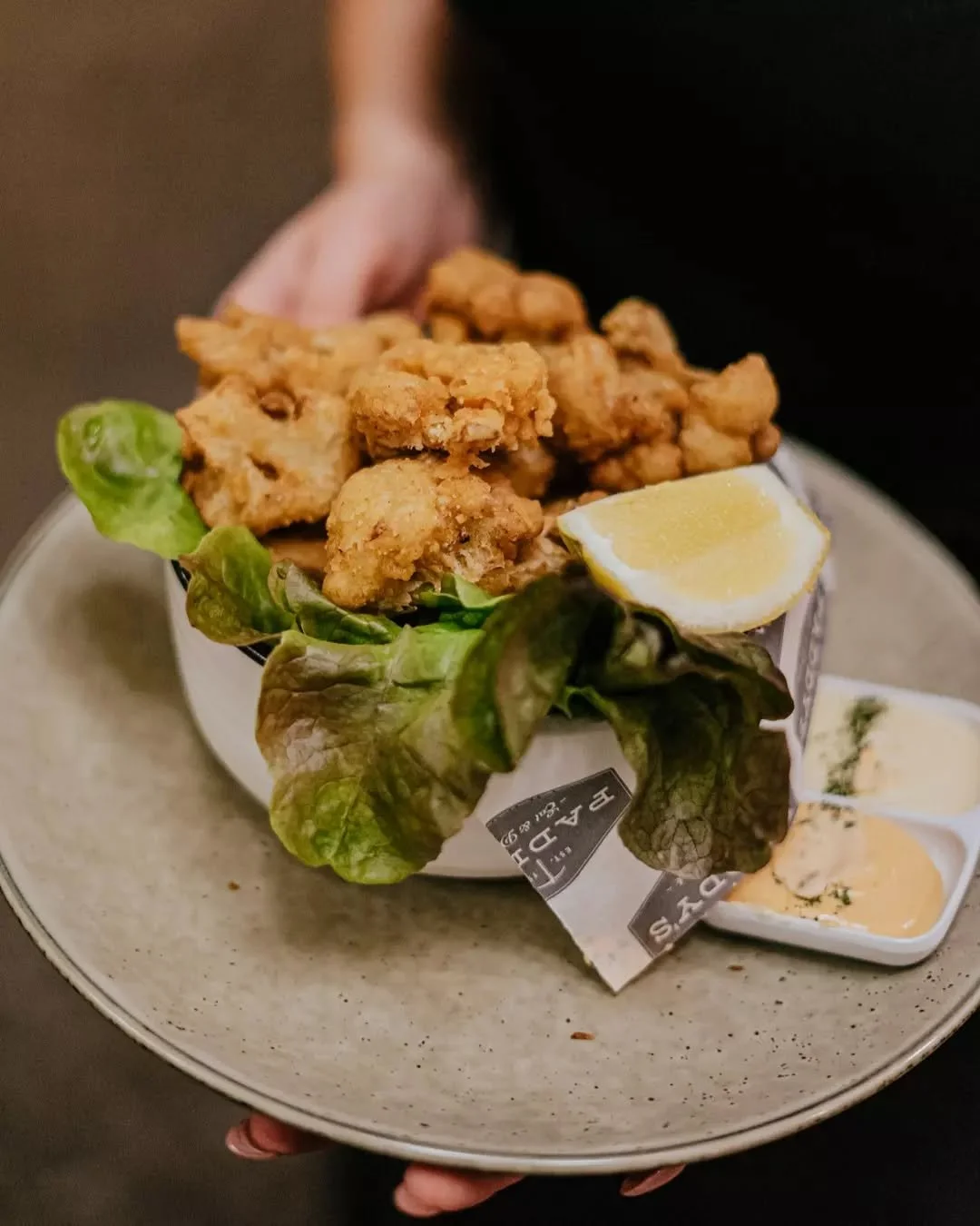 Cauliflower, but make it addictive, our Cauliflower Bites are fried to perfection and served with aioli and lemon ✨

100% vegan and 100% gone before you know it.