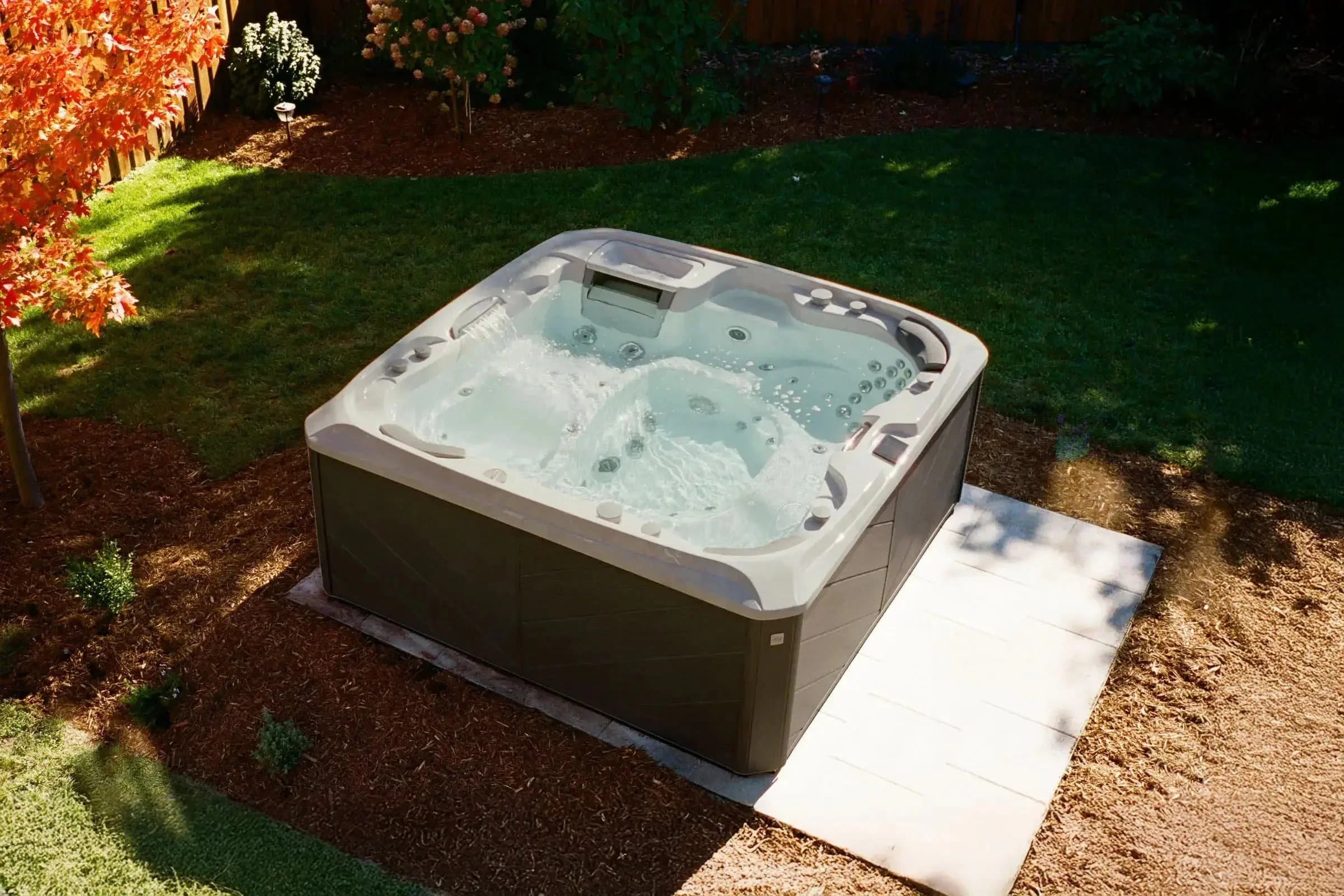 sundance series 880 hot tub top down in back yard