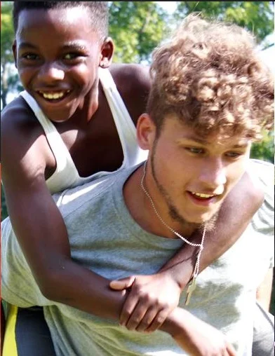 Camp-JOY-boys-carrying.jpg