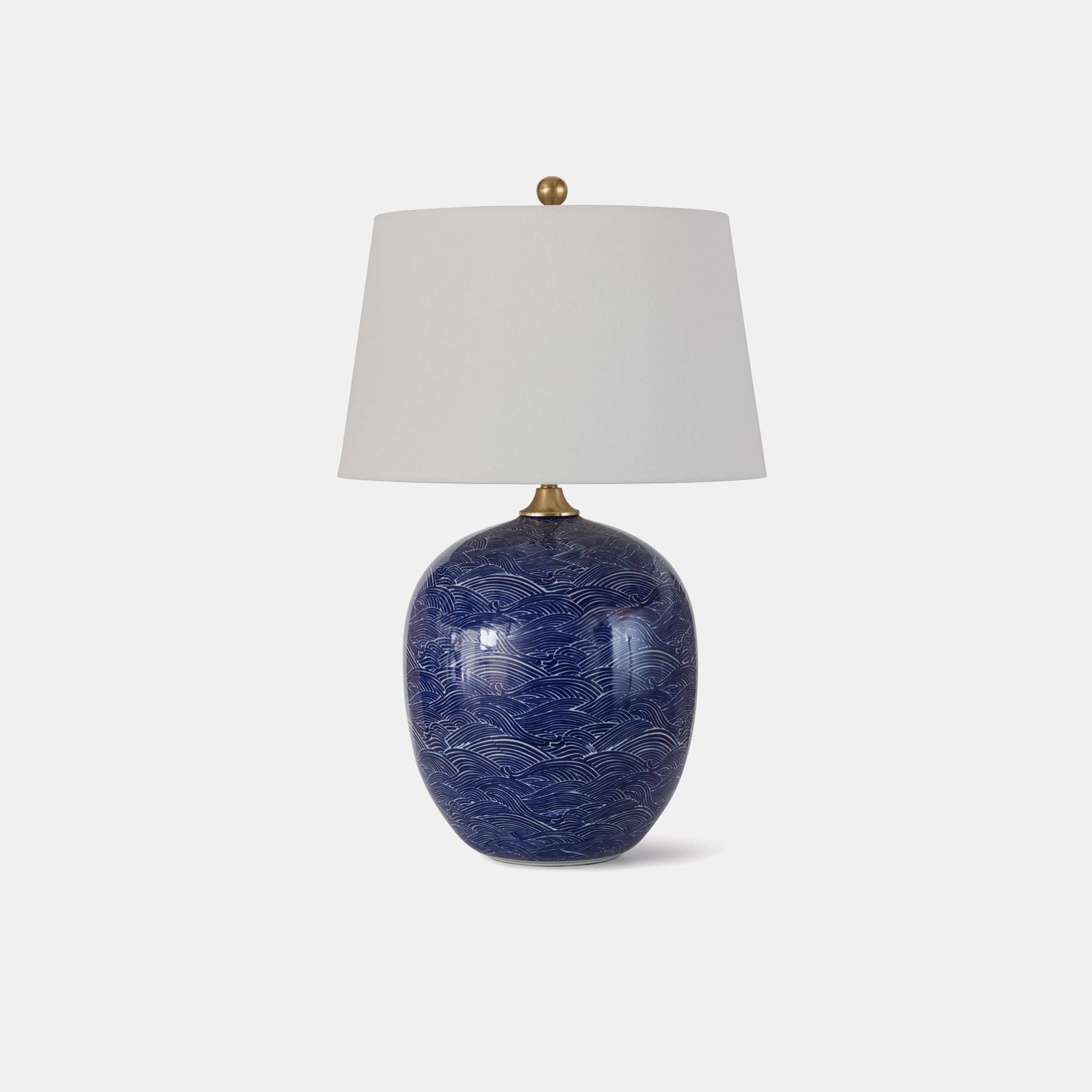 Harbor Ceramic Table Lamp 18” round x 29”h Available in blue (shown) and black. SKU3I239RAD