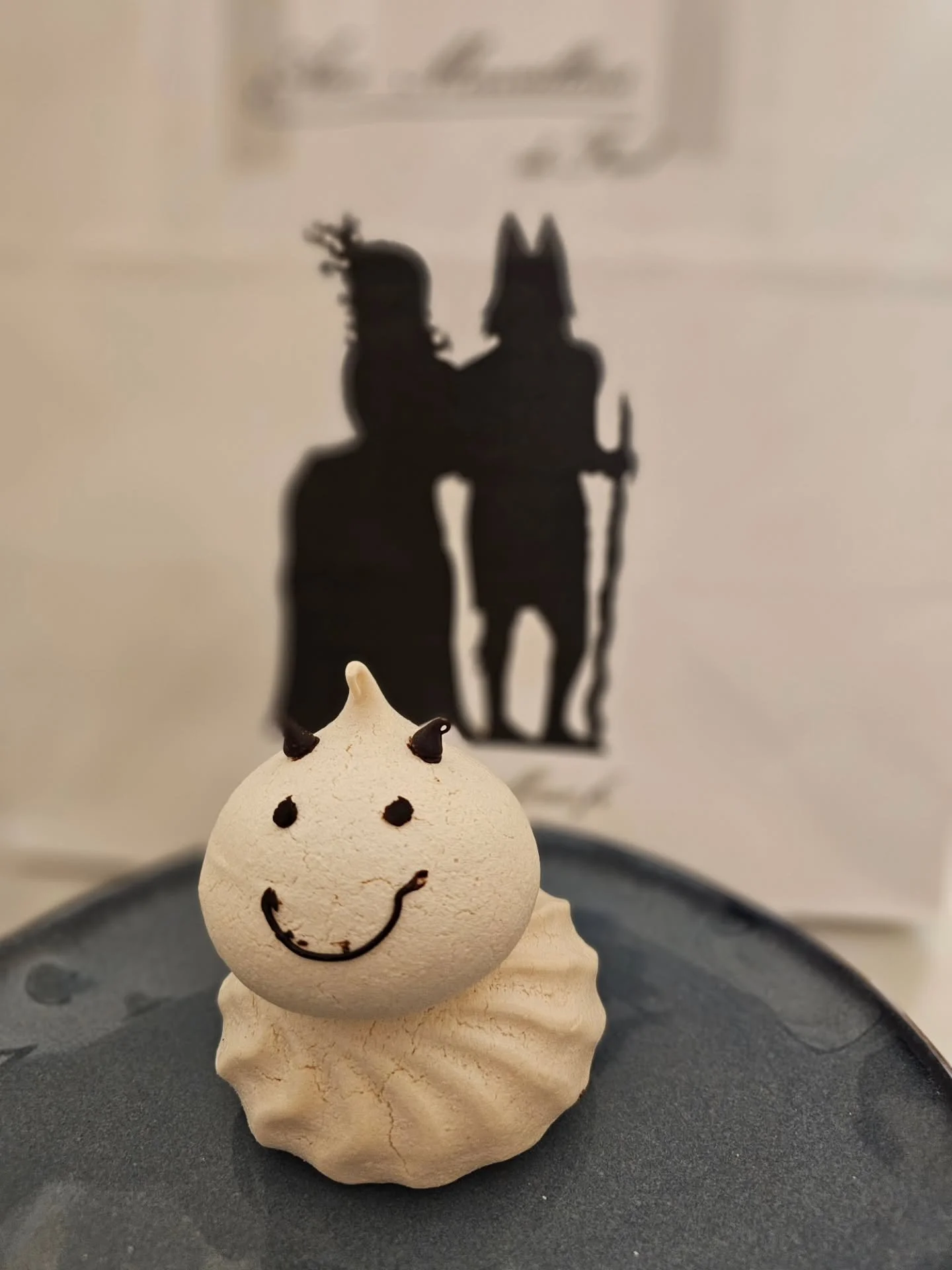 Turned something exciting in today &amp; celebrated with this tiny meringue fant&ocirc;me. Who knew ghosts could be so delicious? ✨️👻

Also pictured:

Notre Dame peeking from behind the buildings
The prettiest tins of sardines I've ever seen 
Locks 