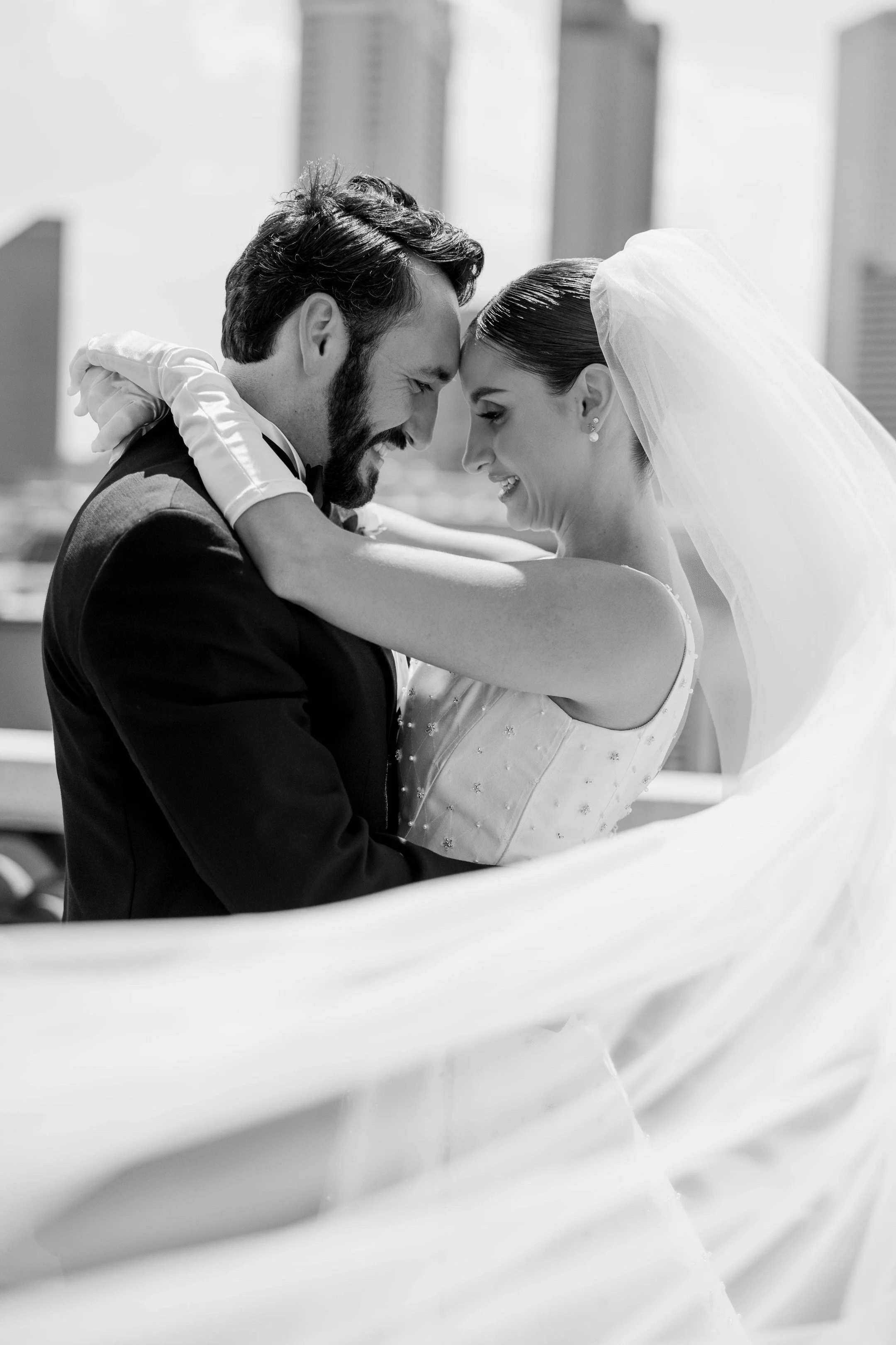 Bride and groom sharing a quiet moment overlooking downtown New Orleans after their wedding ceremony at St.Louis Cathedral.