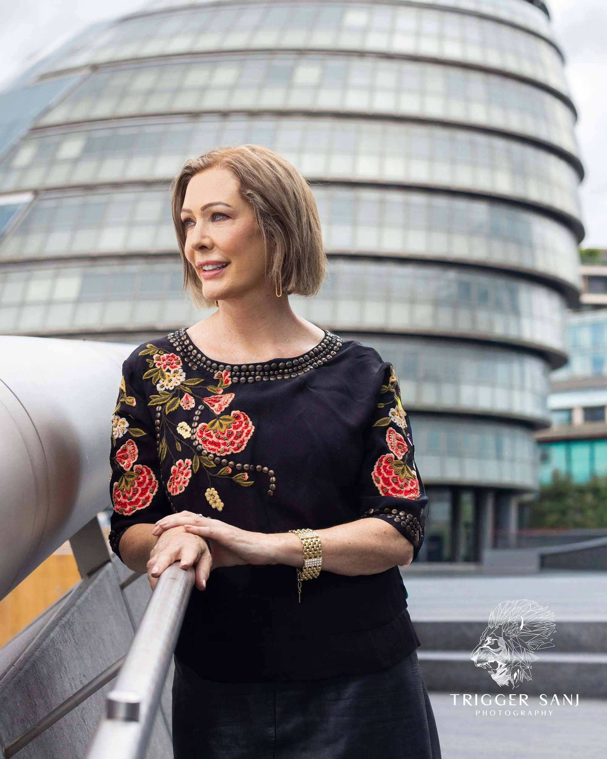 Female business owner posing outside of City Hall, London