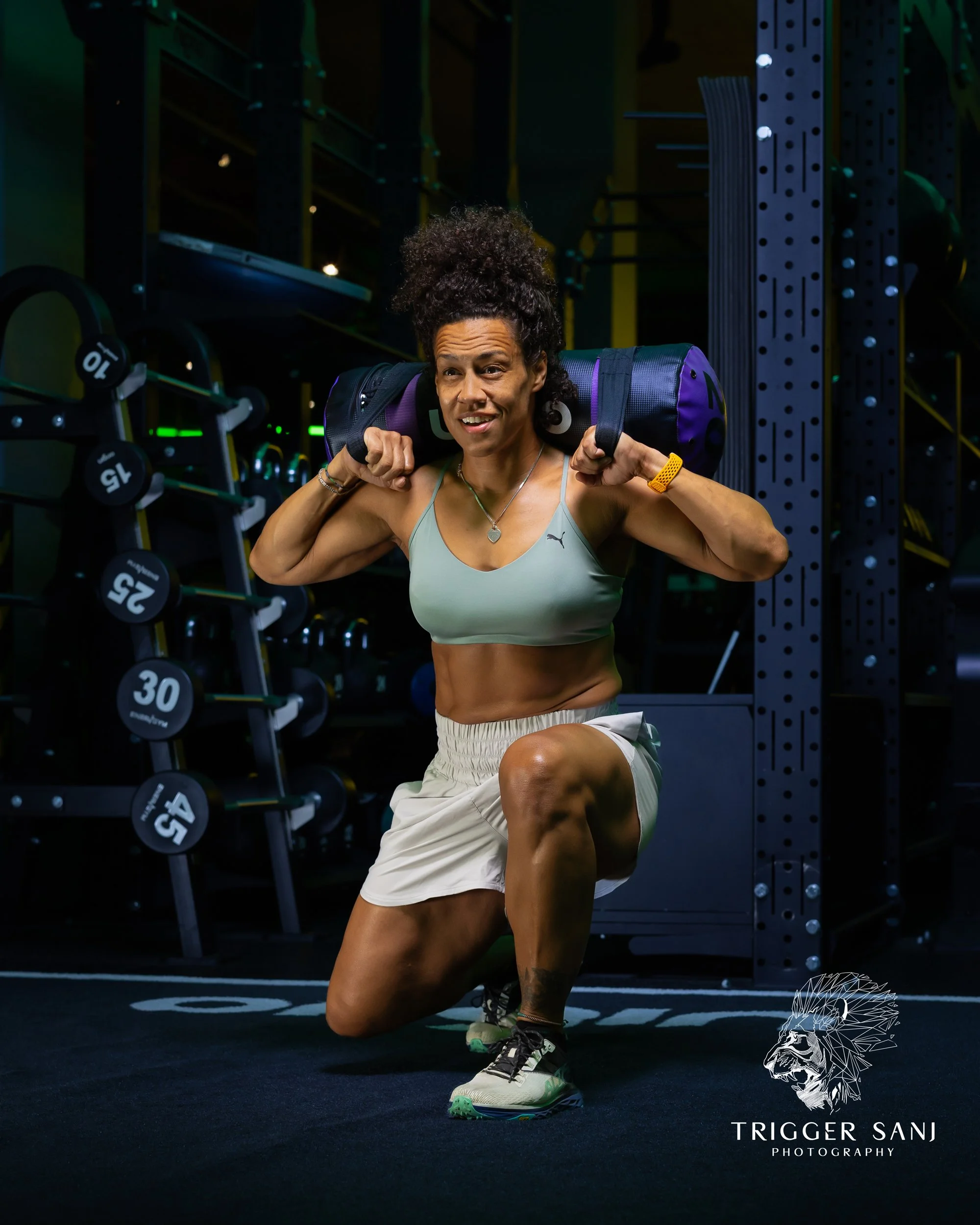 Female personal trainer doing split squats