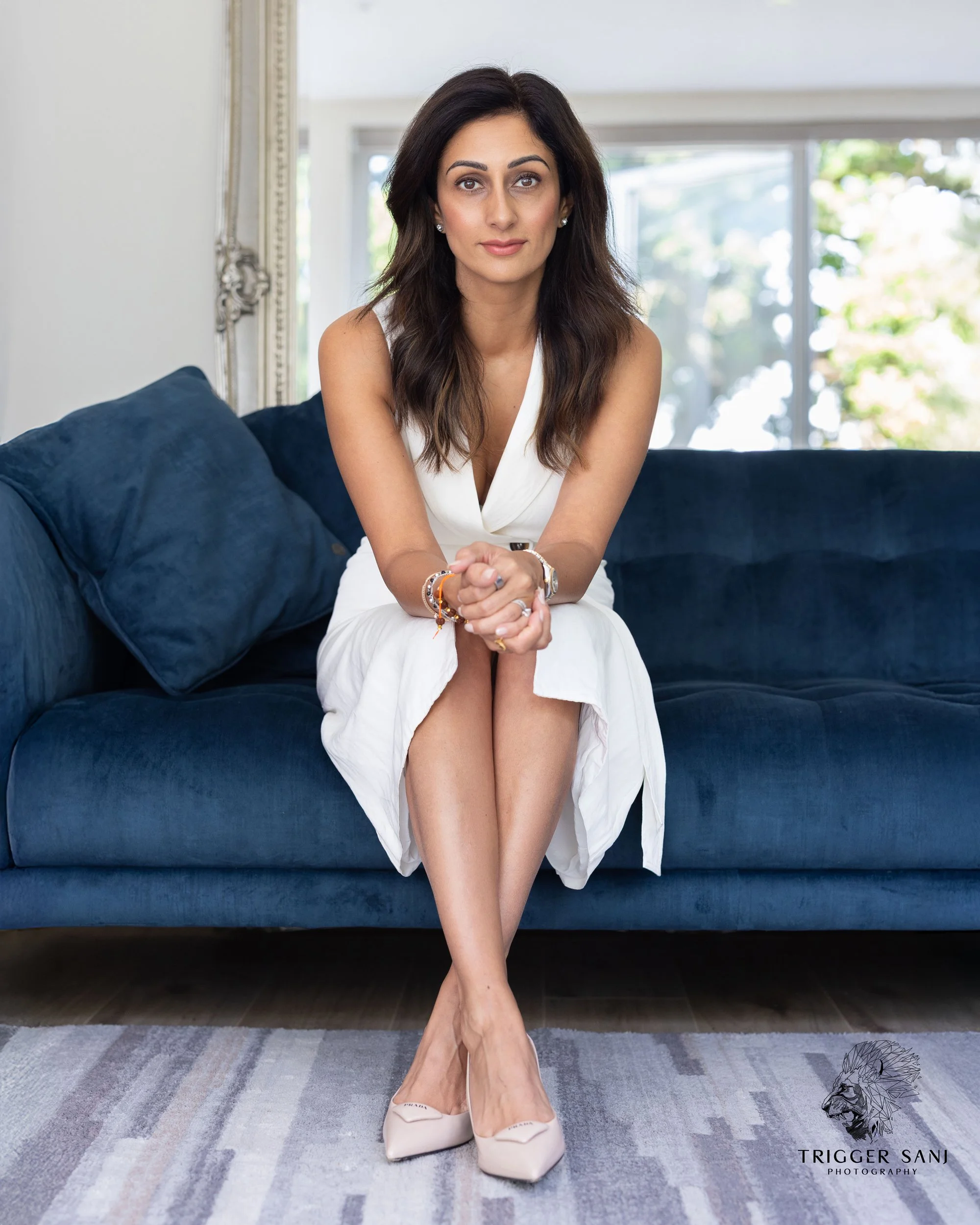Portrait of a female business owner sitting on her sofa