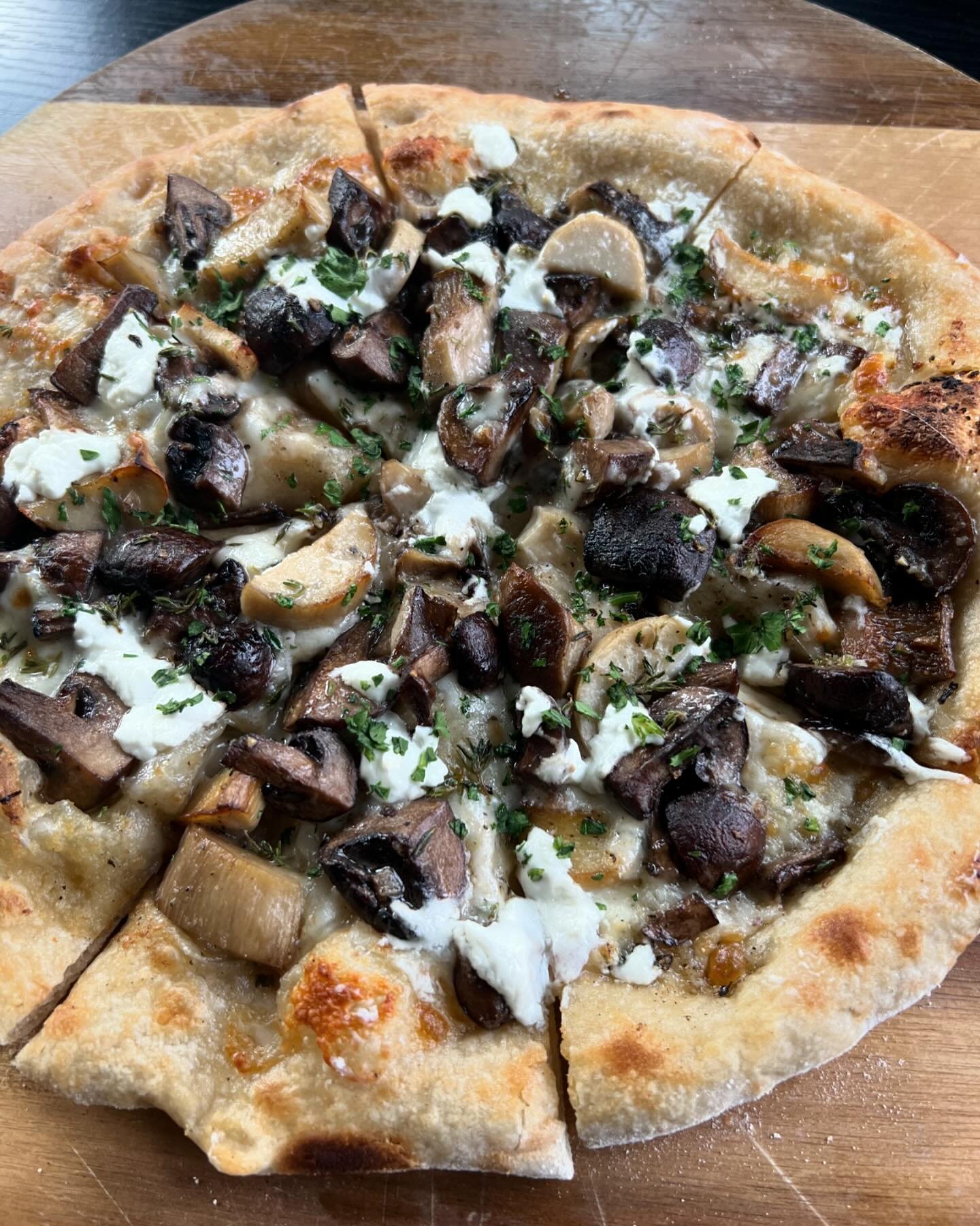 New to the menu, our Funghi Pizza, topped would Crimini and Trumpet Royal Mushrooms, Goat Cheese, Mozzarella, and Thyme.