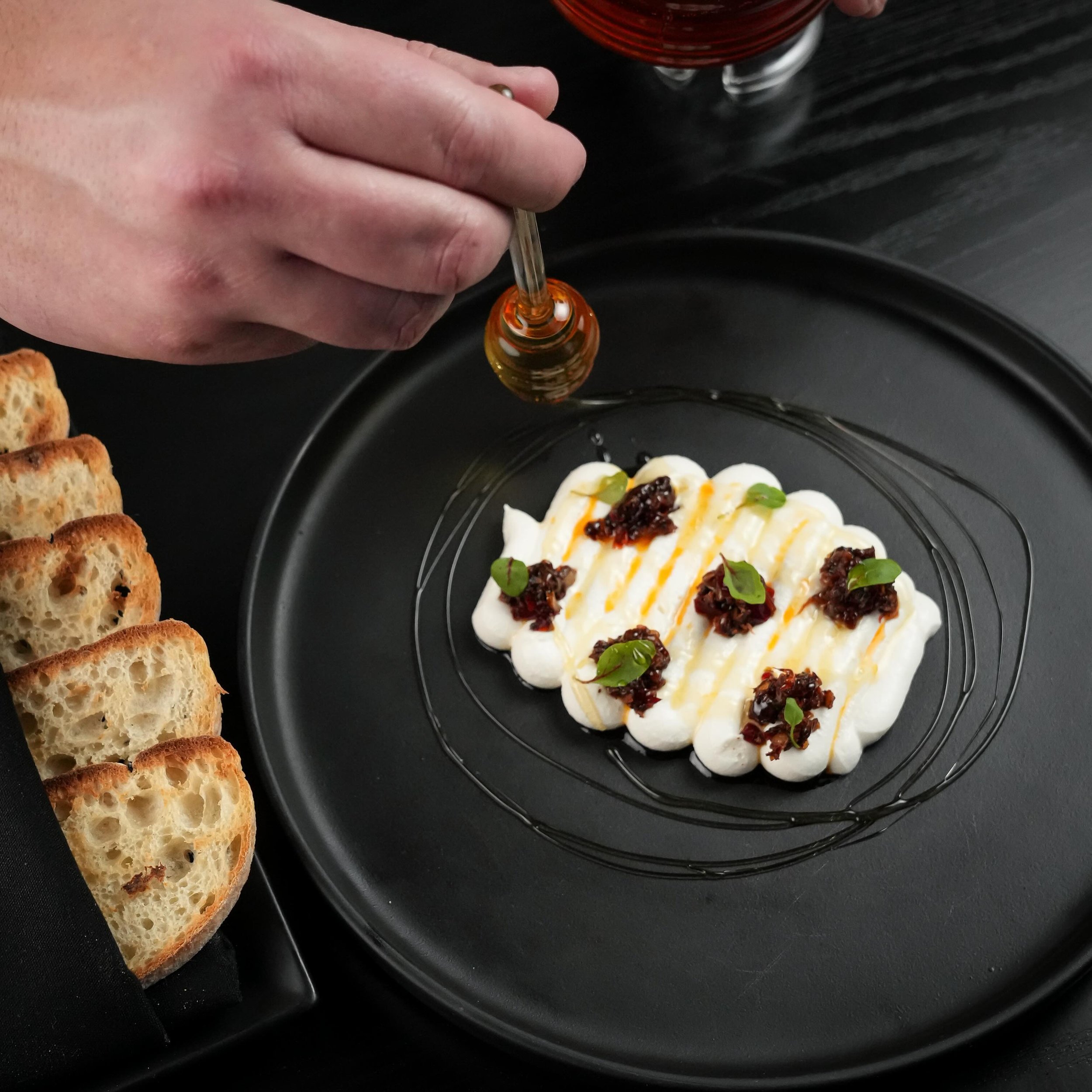 Whipped Ricotta with Desert Honey and @chefjacobw special Chili Crunch is calling your name!