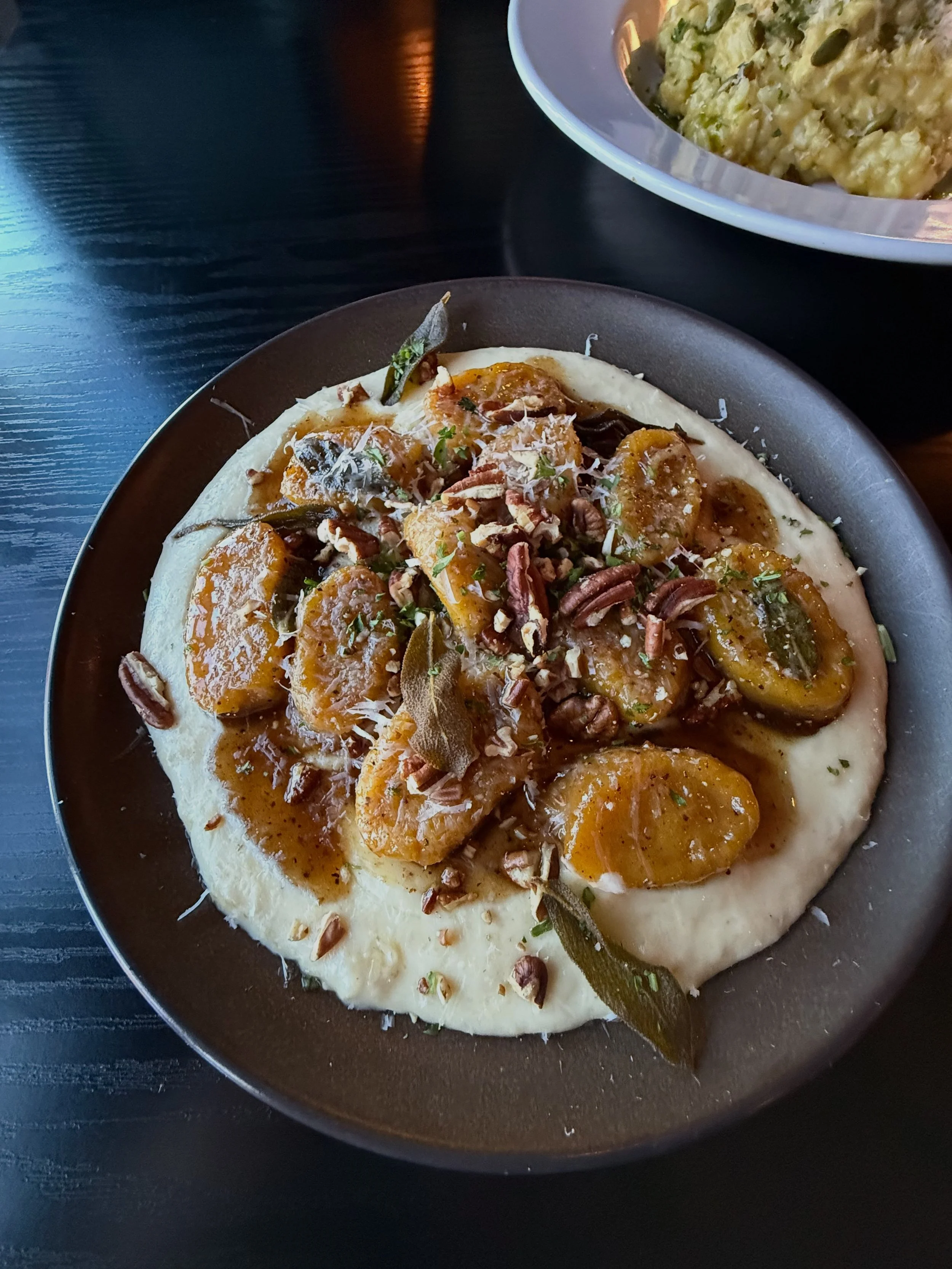 Pillowy Squash Gnocchi kissed with toasted pecans, maple, nutmeg, and sage, resting on a silky parsnip pur&eacute;e and finished with Parmigiano.

Reservations &amp; takeout: link in bio
📍 7995 Blue Diamond Rd, Las Vegas
702.330.0404