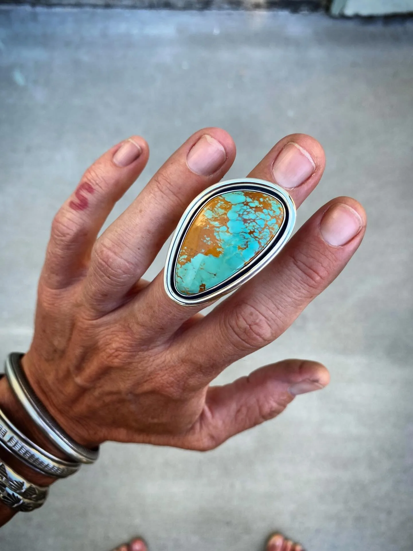 Rising Phoenix Minimal Shadowbox Statement Ring✨✨

This stone immediately captured my heart when I sourced it some time ago. Rising Phoenix Turquoise is one of my preferred materials, but the rusty matrix creeping in from the left makes this stone ab