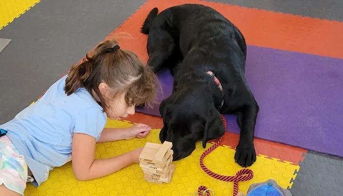 ADW after school program girl with assistance dog.jpg