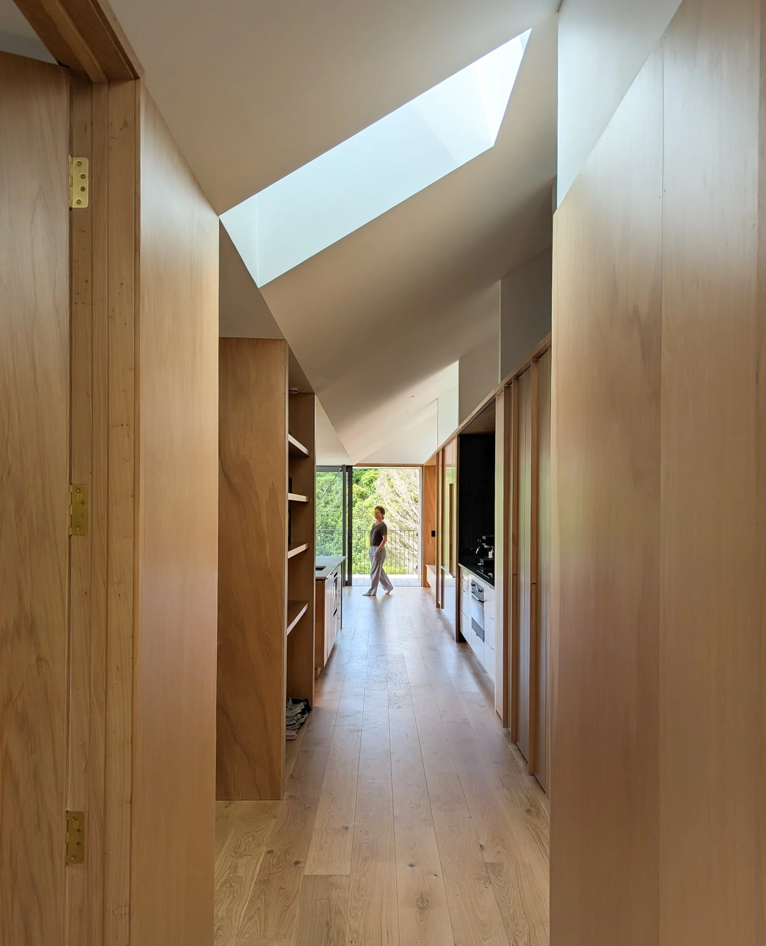 Hallway with skylights in the Island Bay Hill House by Lovell and O'Connell Architects, LOCA Wellington and Wanaka