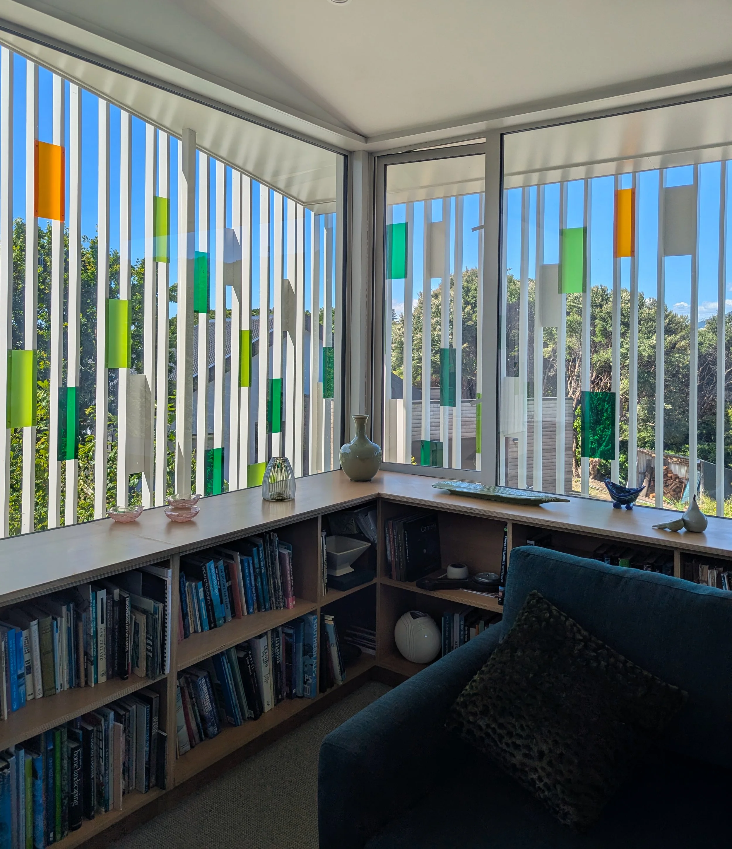 View of the Living Room and exterior screen, The Filter House, Kapiti, by LOCA, Lovell and O'Connell Architects with studios in Wanaka and Wellington