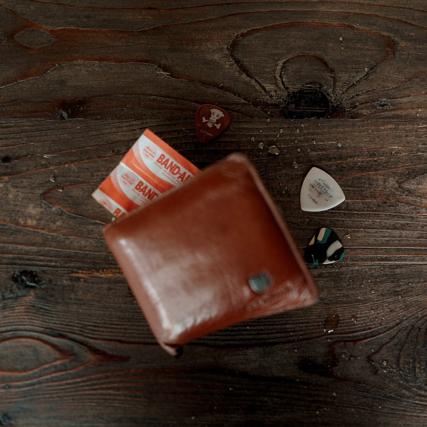  When he died and we got ahold of his belongings, I was quick to check his wallet for two things I knew that would be in it: band aid and guitar picks.  Two things you always have to be prepared for in life-- in case you get hurt and when you just ne