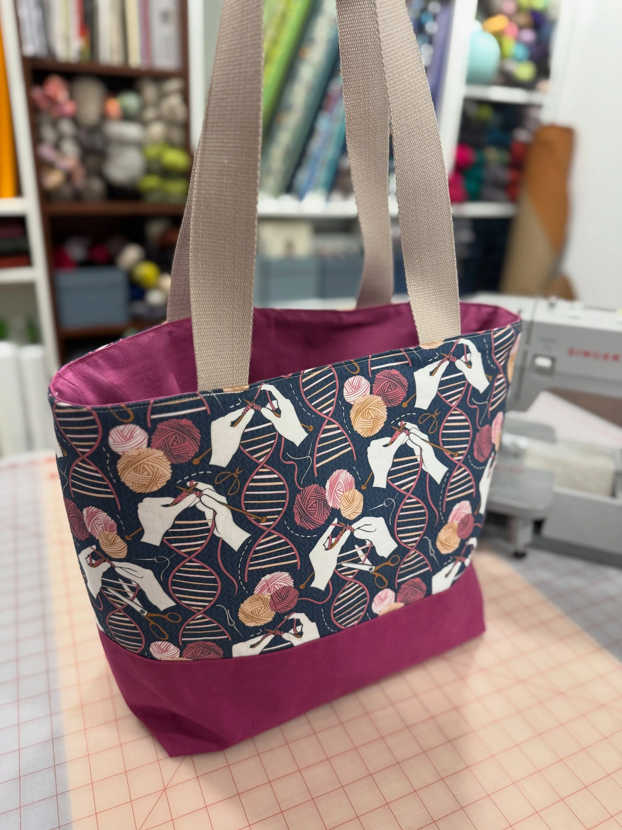 Another Custom tote! This vegan bag is the standard tote dimensions and webbed straps, with an added oil cloth base (water resistant) and some interior pockets, including 2 pen holders. It's a perfect example of seeing a fabric you love but not in th