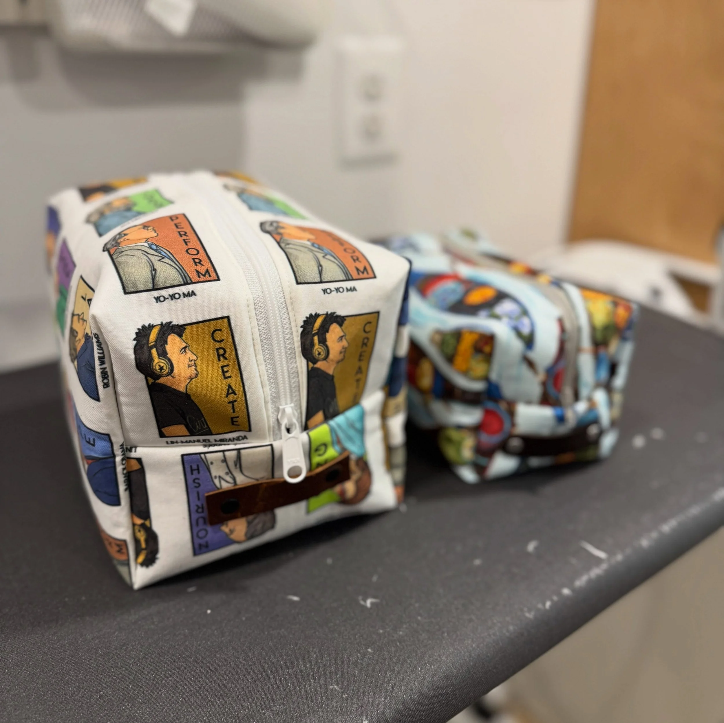 This custom extra large Box Bag is 2" taller and wider than our standard model, stitched up in @karenhallionart He-series fabric and a navy water resistant waxed canvas with reinforced, riveted brown leather pull tabs 🪡 

Love this size or the 