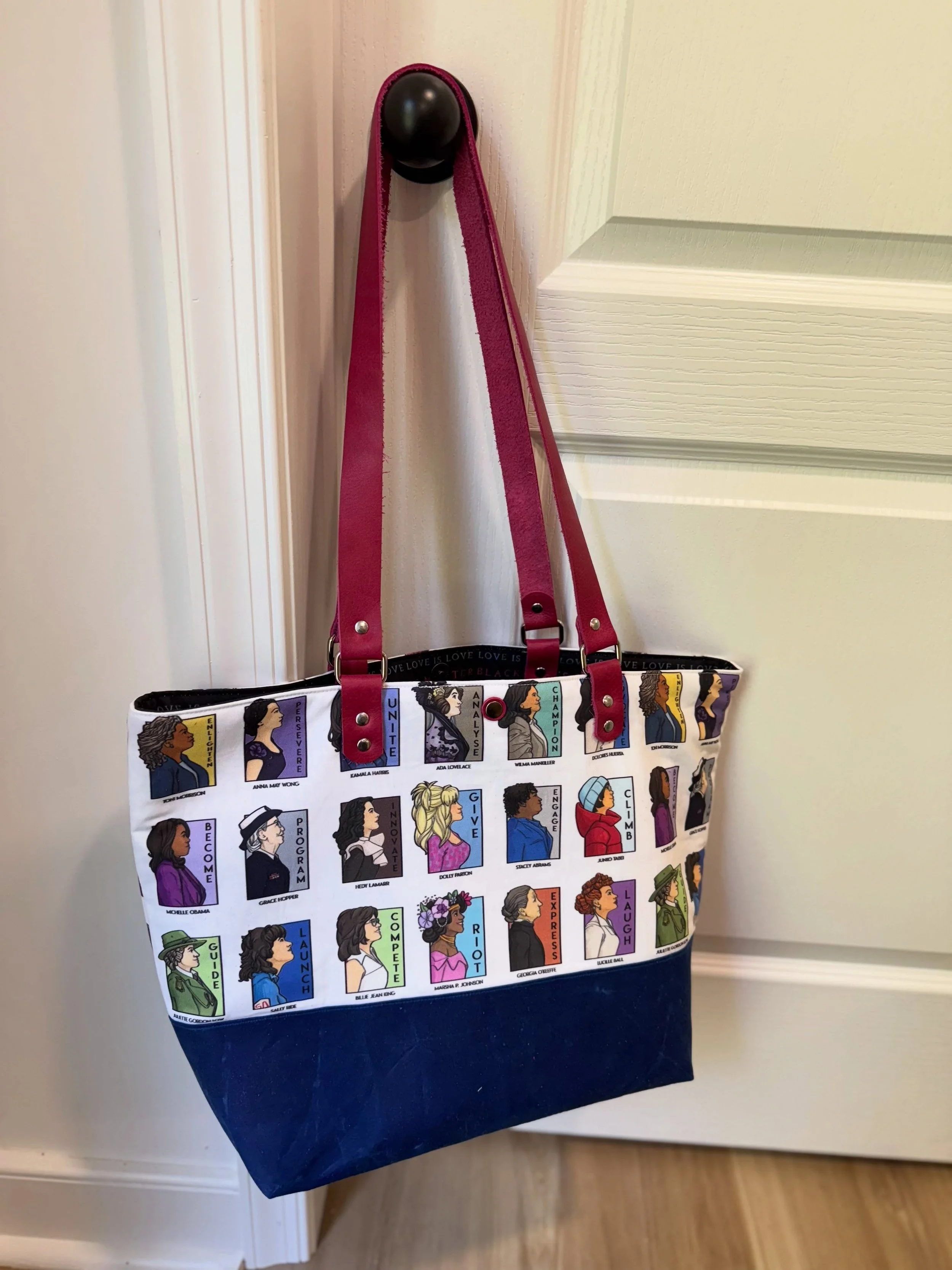 Another custom Girls Just Want to Have Fun-damental rights tote! This version has a waxed canvas (water resistant) base, hand-cut, foldable, riveted pink leather straps with nickel hardware including a magnetic snap, and lined with four book-sized po